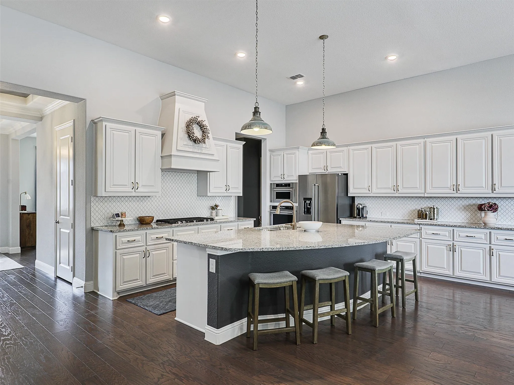 Kitchen featuring backsplash, dark wood-style floors, pendant lighting, and recessed lighting