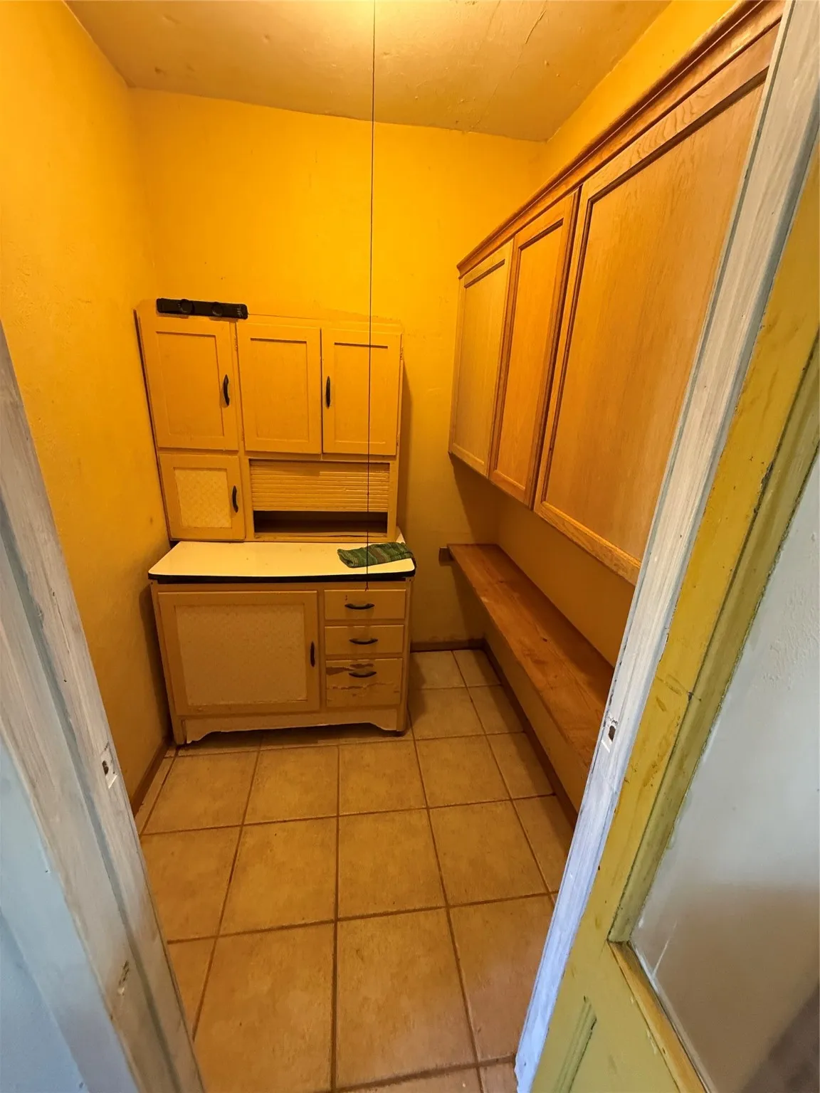 Bathroom with light tile patterned flooring
