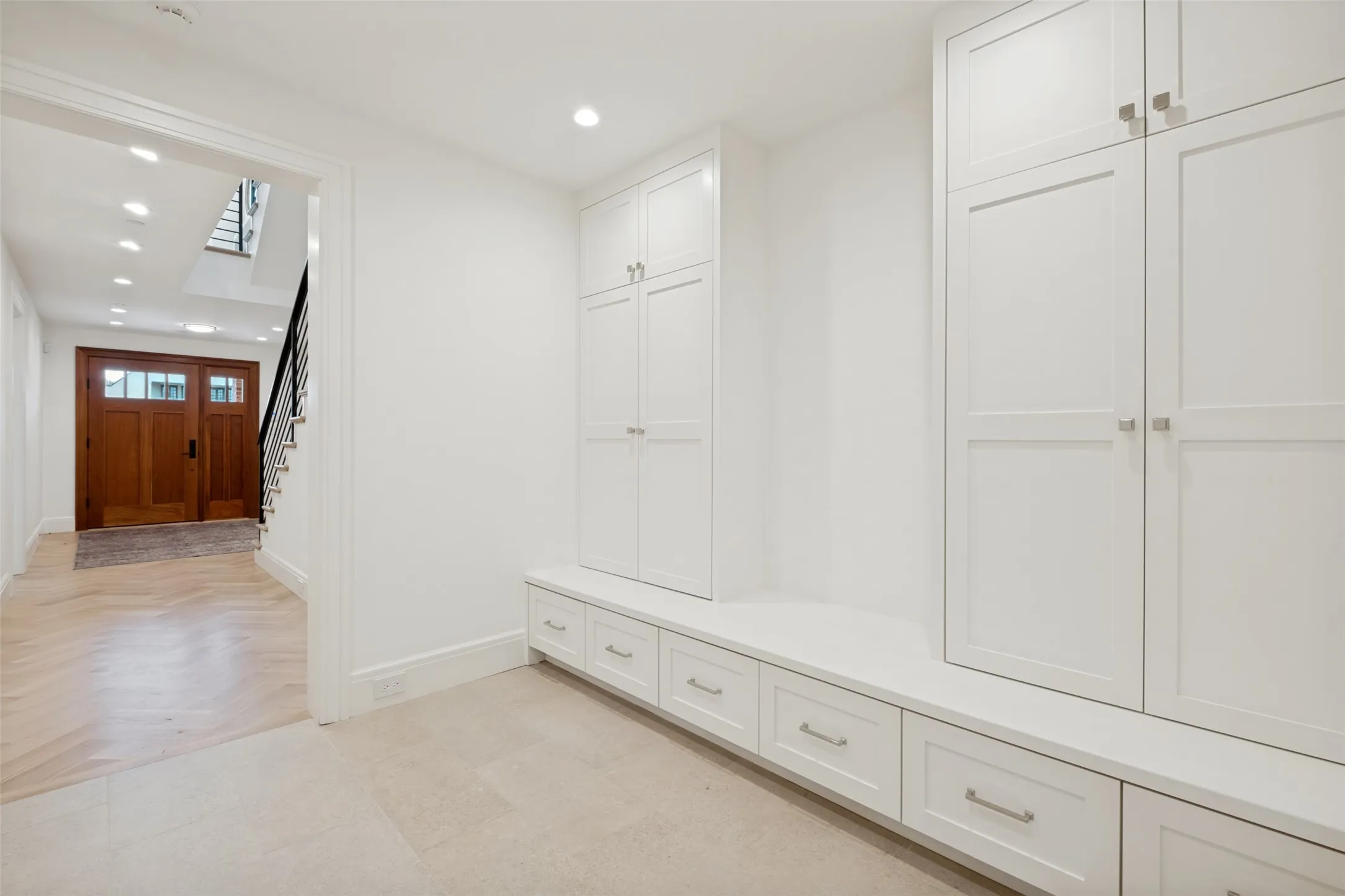 Organized mudroom is accessed from the garage.  Great storage and organizing area.