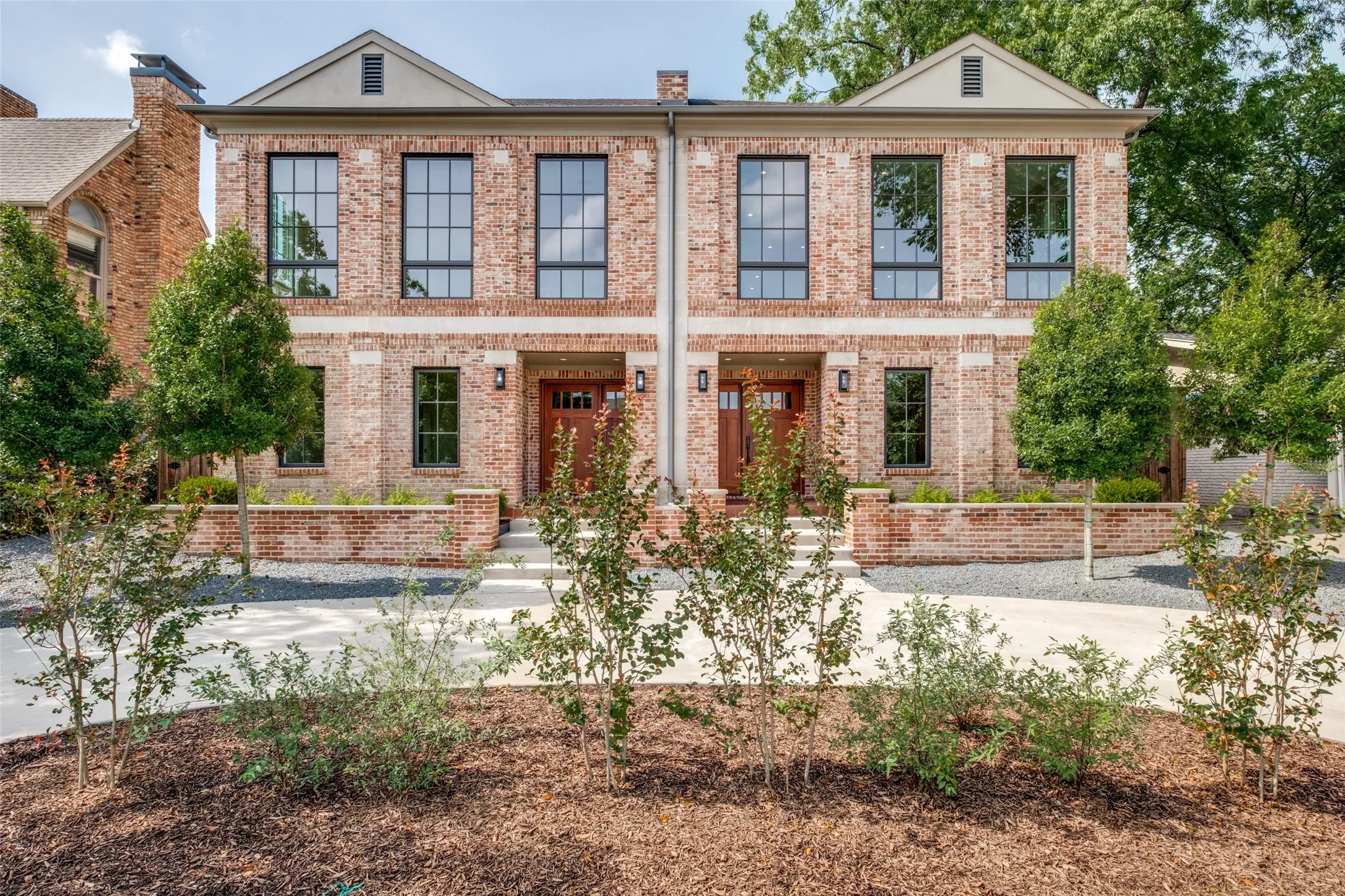 Nestled in beautiful landscaping, the residence ha multiple windows throughout the property, making every room light and bright.
