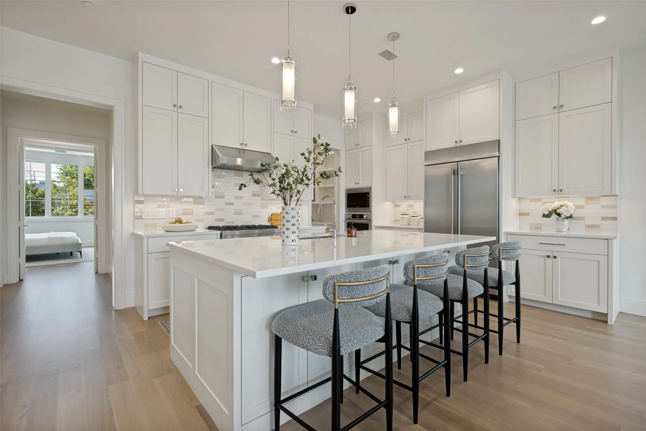 State-of-the-art stainless steel appliances, designer surfaces, and abundant storage make this kitchen a dream.