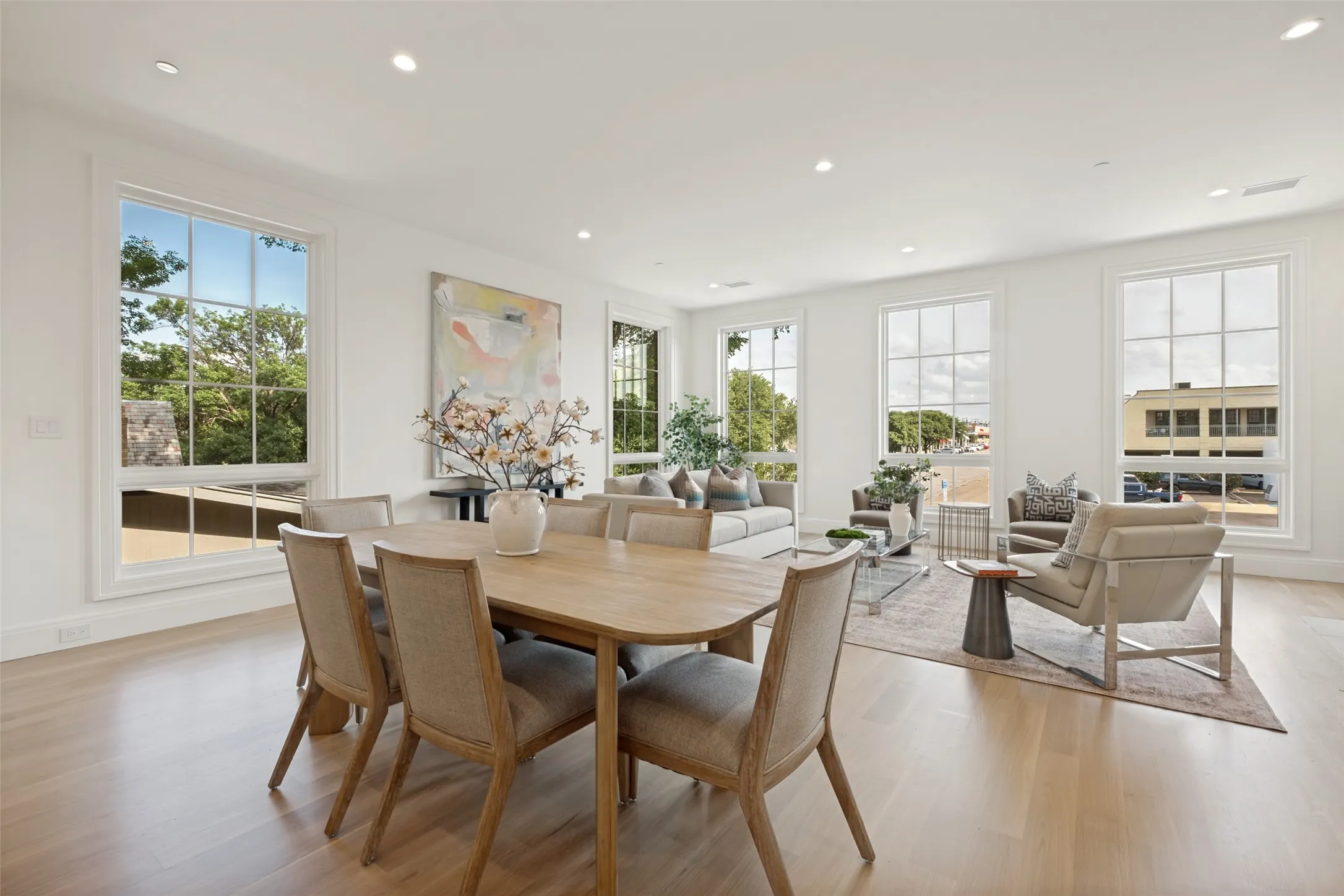 The open floor plan, complemented by abundant windows, creates a bright and airy space perfect for both everyday living and entertaining.