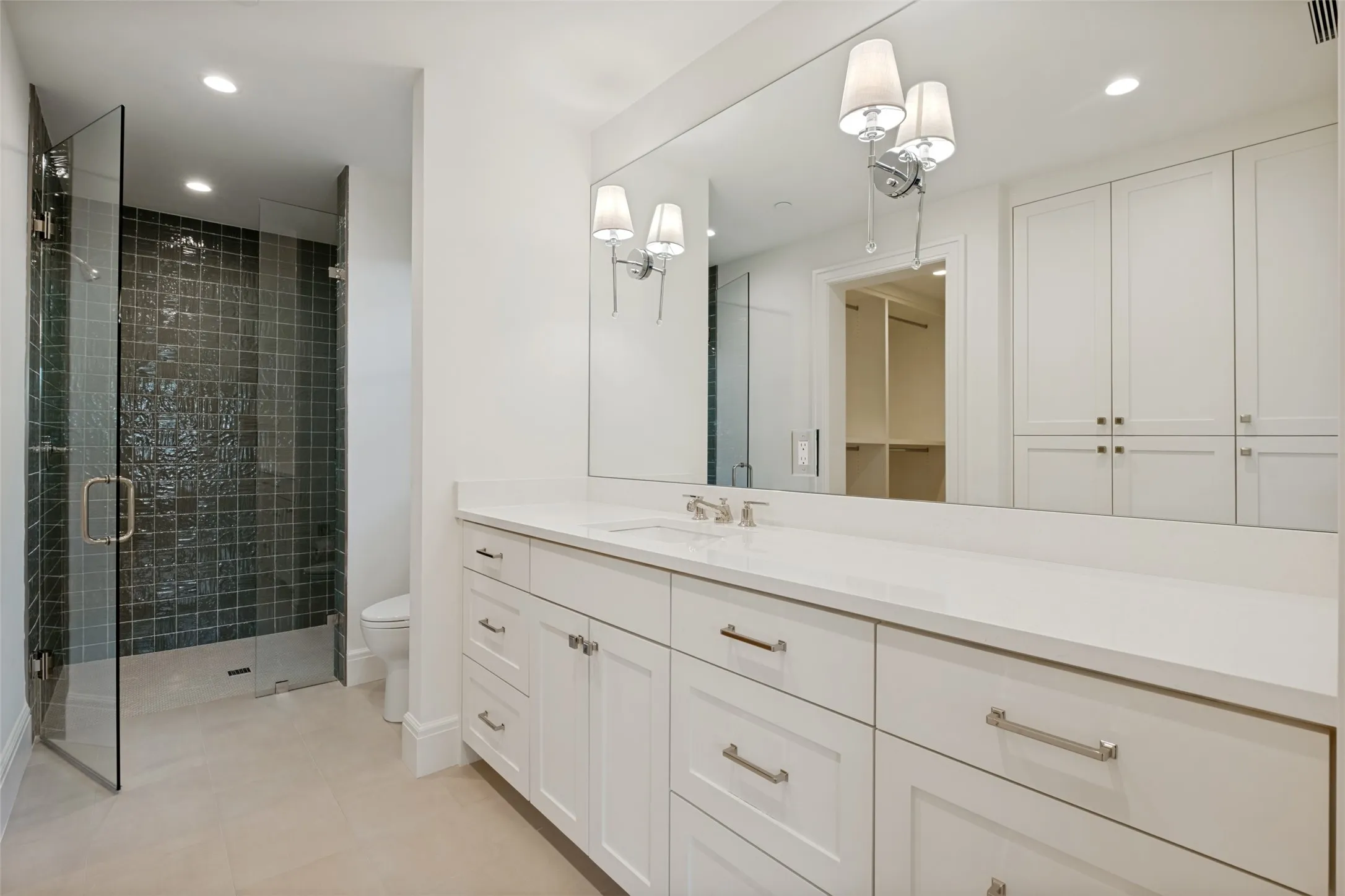 Ensuite bathroom located on first floor, with large secondary bedroom.