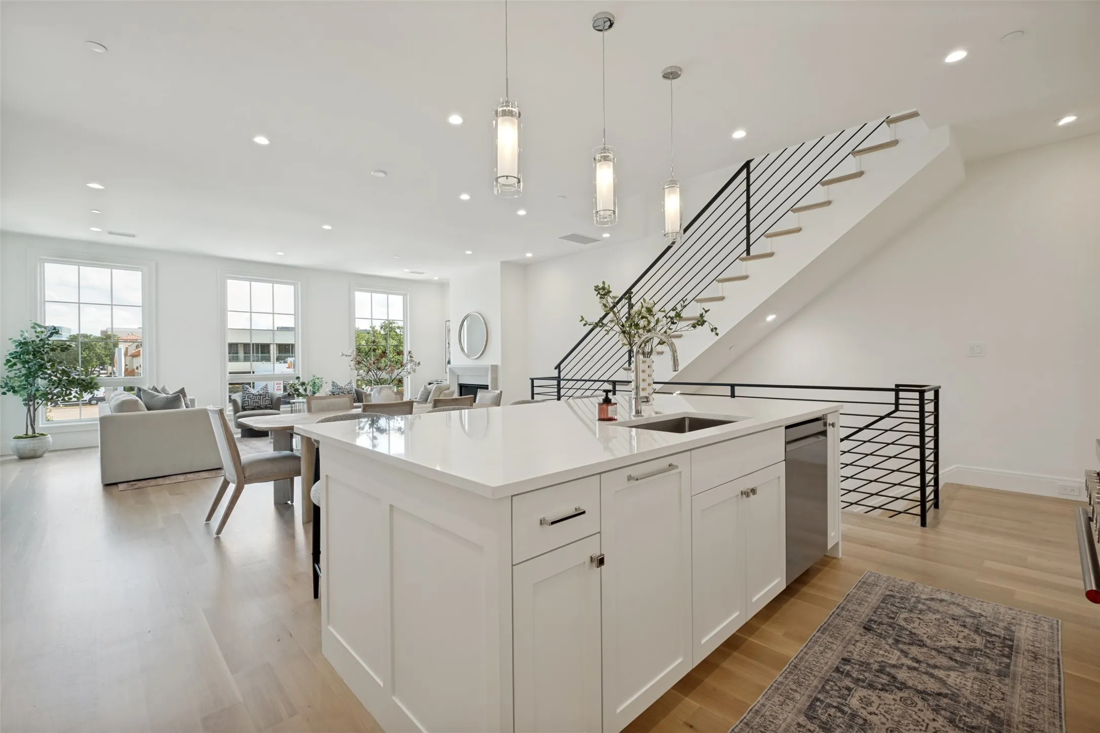 Modern kitchen island featuring integrated storage, stainless steel fixtures, and a dishwasher.