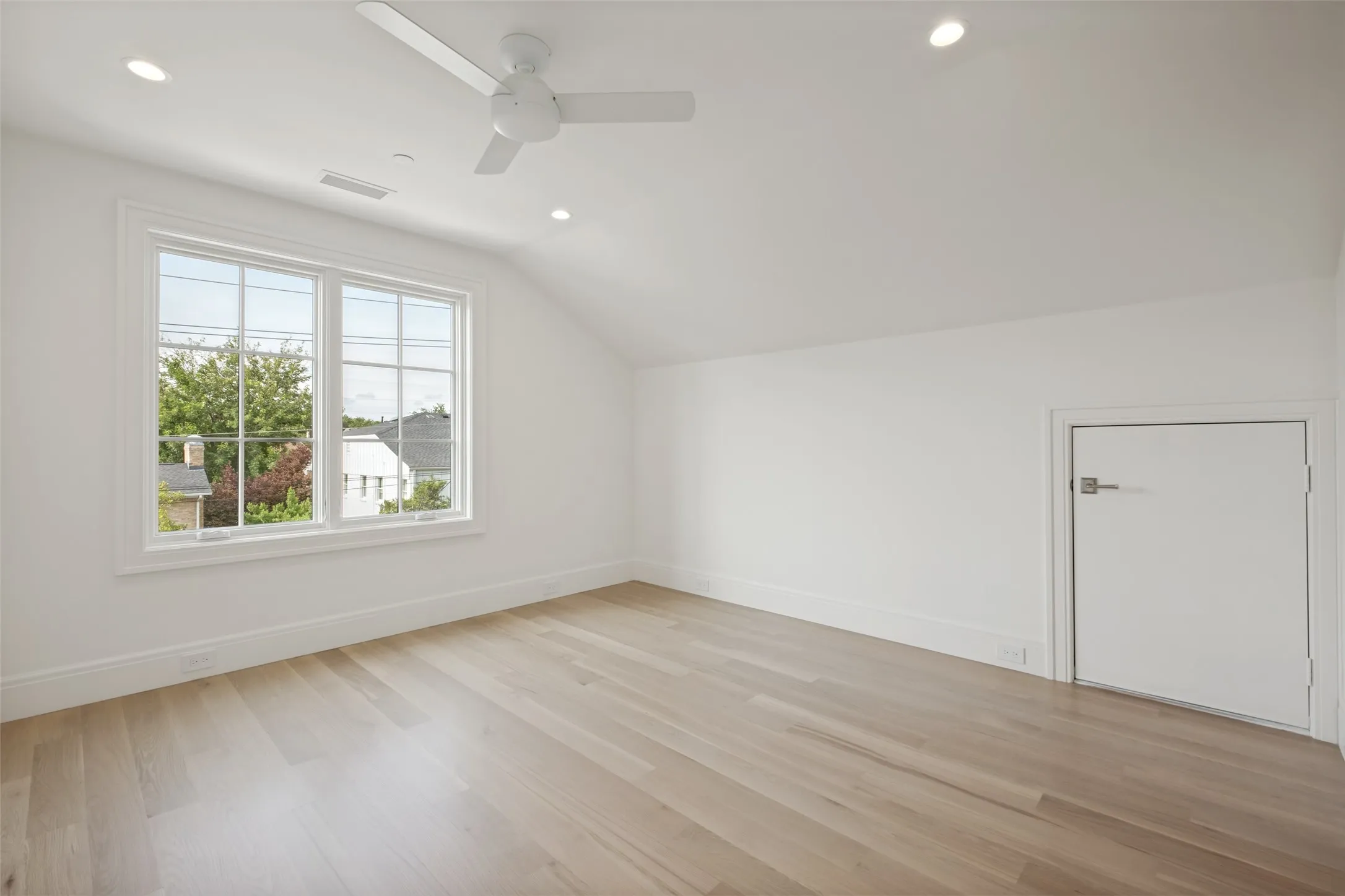 Spacious fourth bedroom situated on the third floor.
