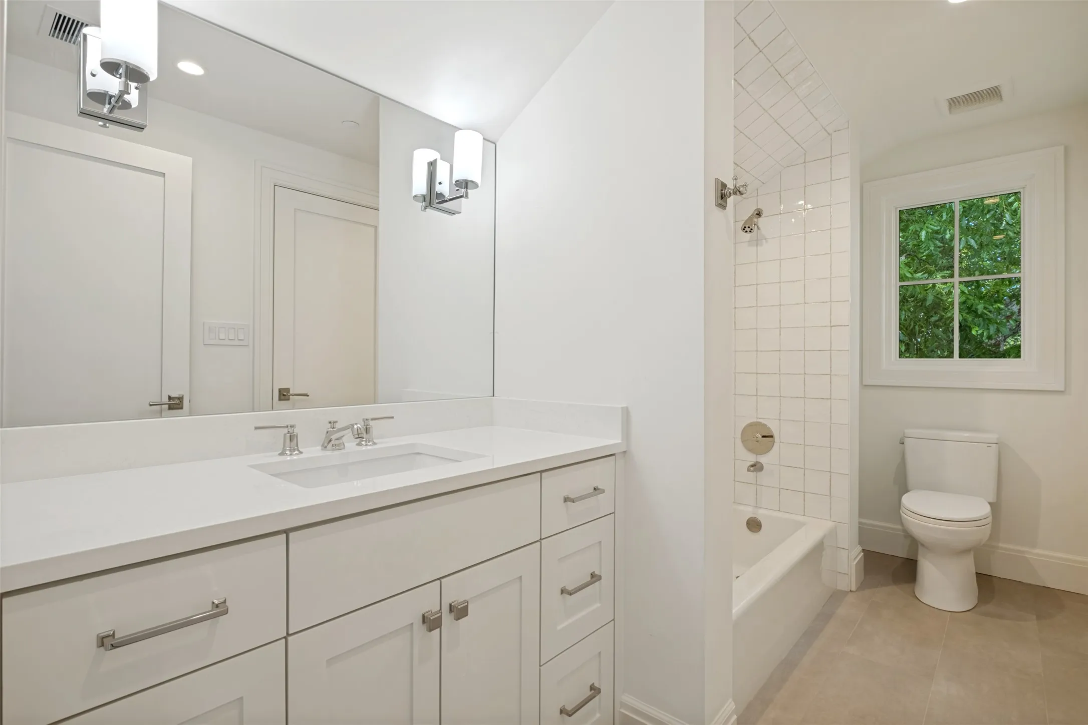 Third-floor Jack and Jill bathroom serving the two adjacent bedrooms.