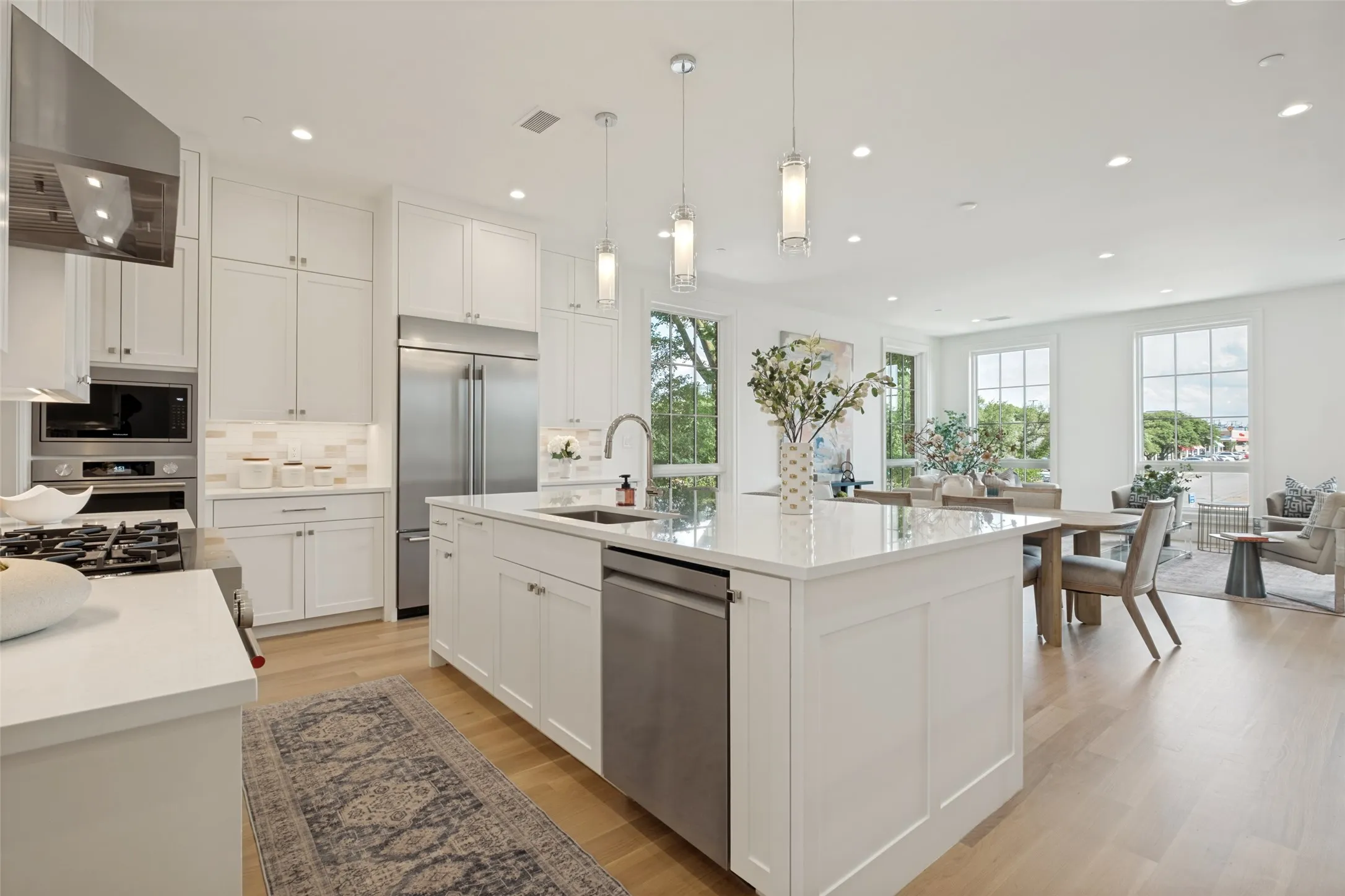 Large kitchen island featuring an efficient prep space and bar seating perfect for casual dining.