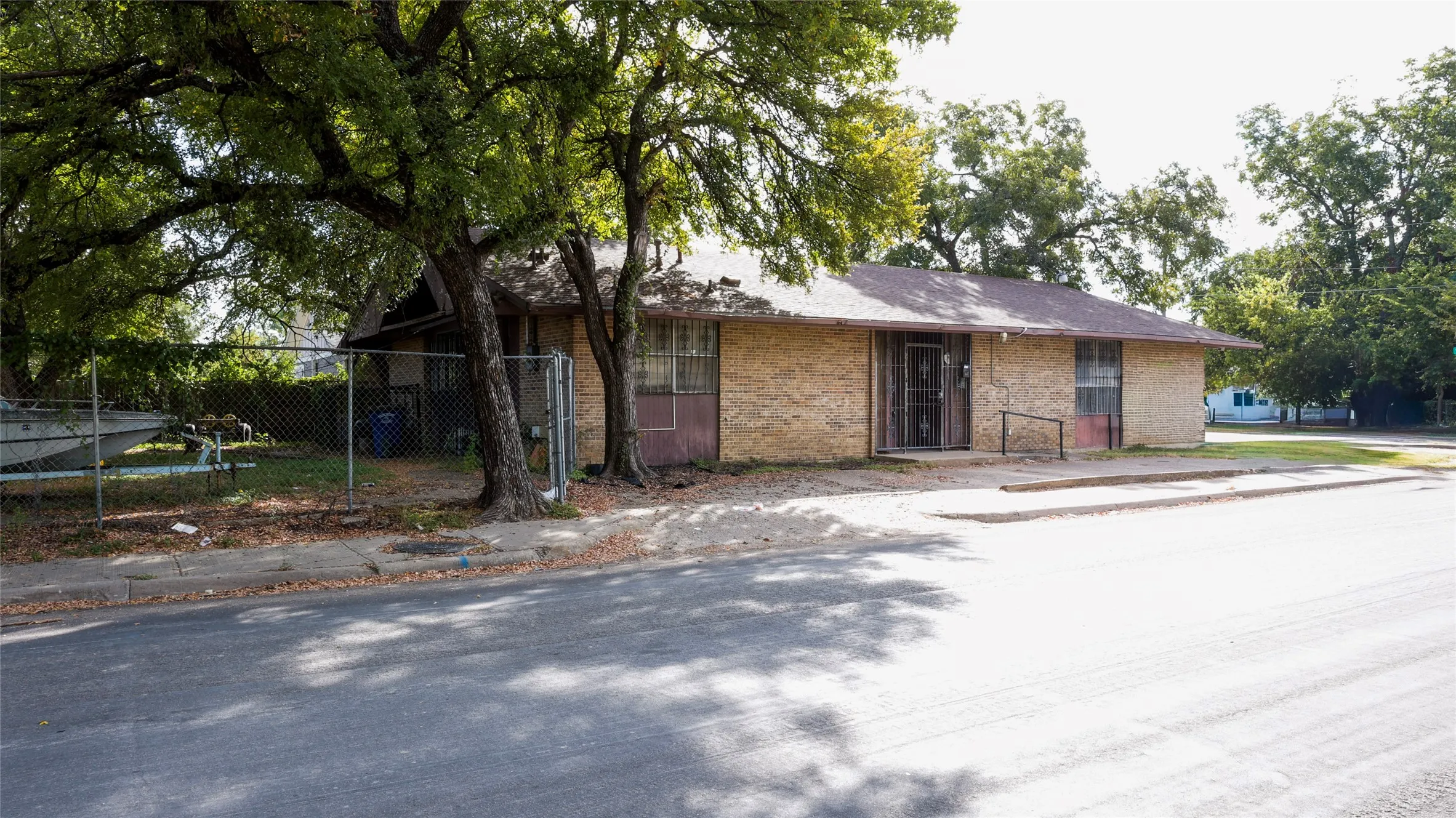 Single story home featuring brick siding