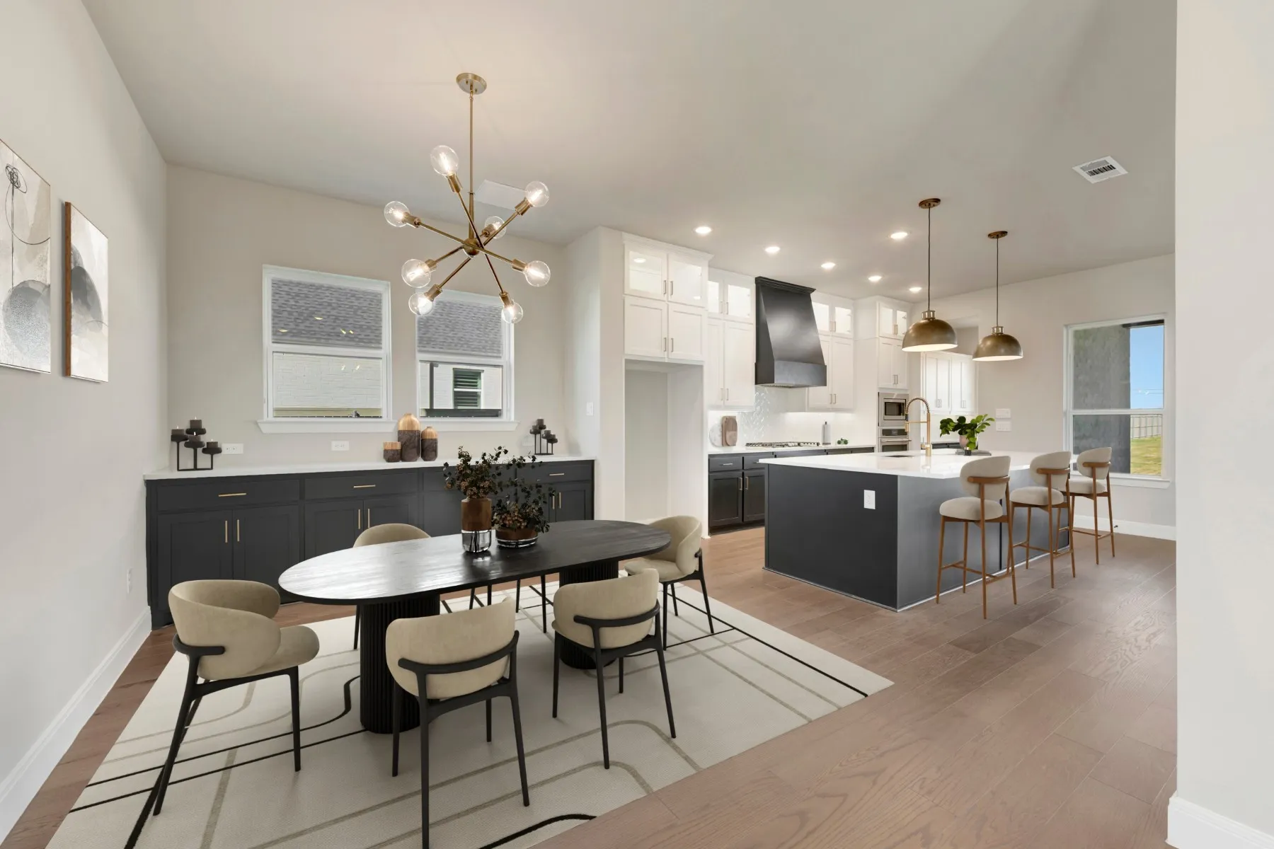 Dining room with light wood-type flooring and suspended lighting