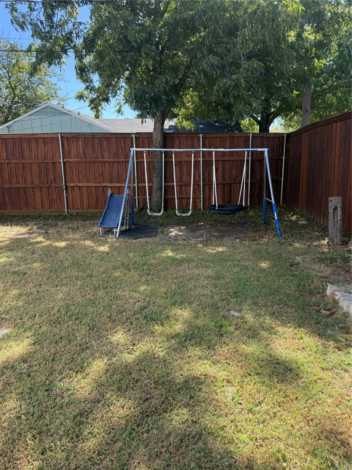 View of fenced backyard