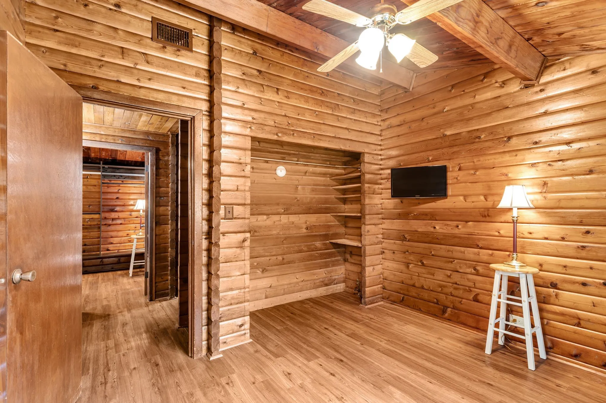 Bedroom featuring wood finished floors, wooden ceiling, and ceiling fan