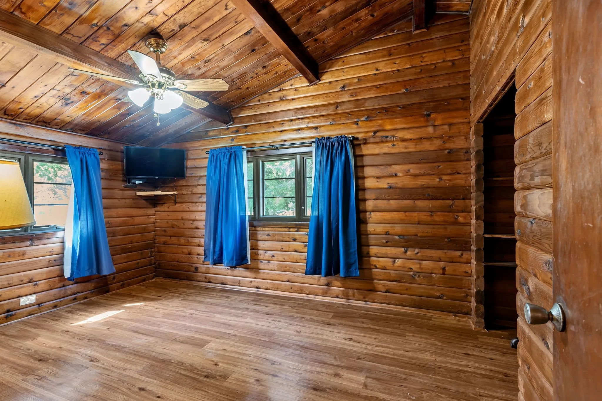 Bedroom featuring wood finished floors, wooden ceiling, and ceiling fan