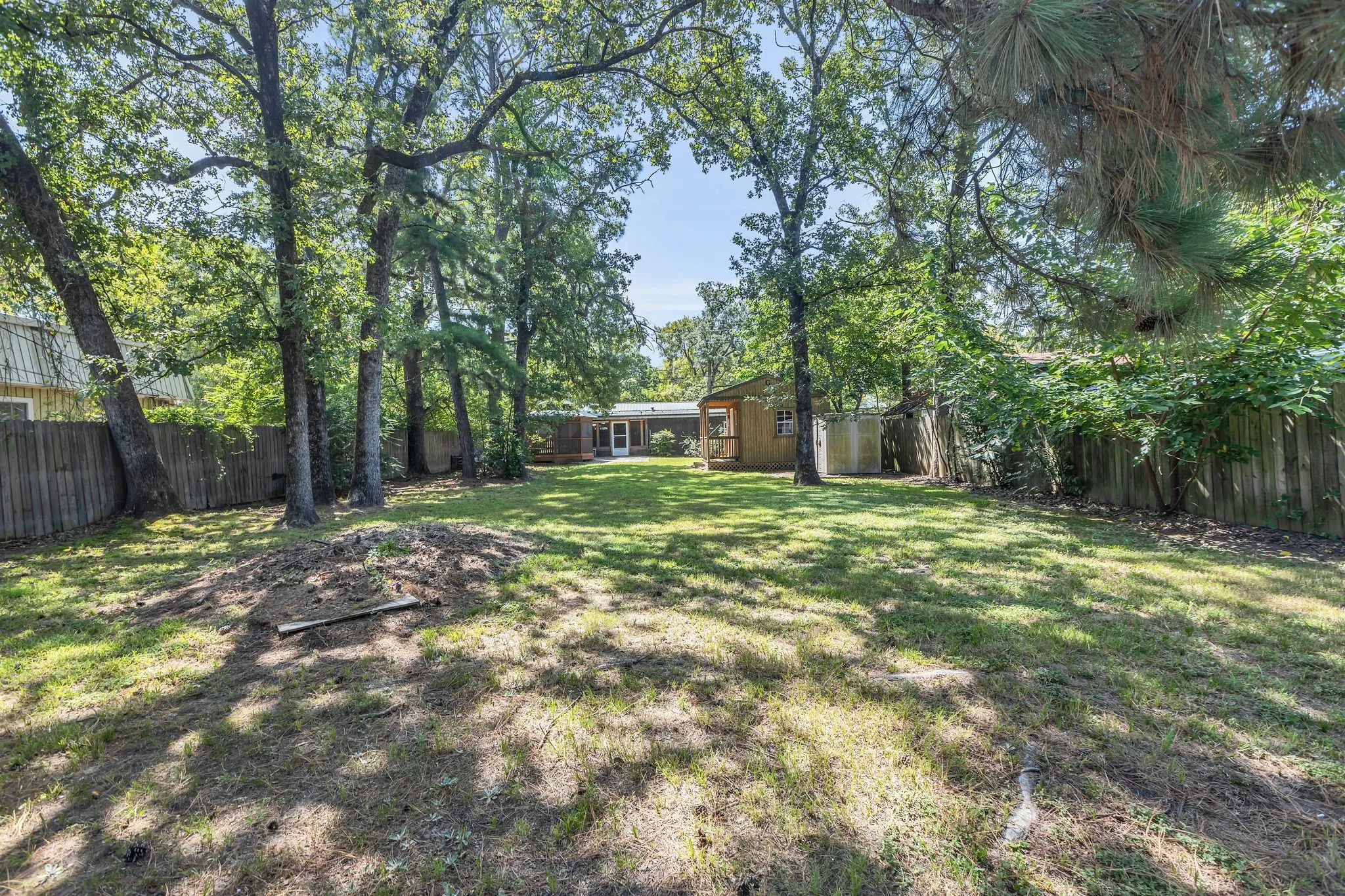 View of fenced backyard