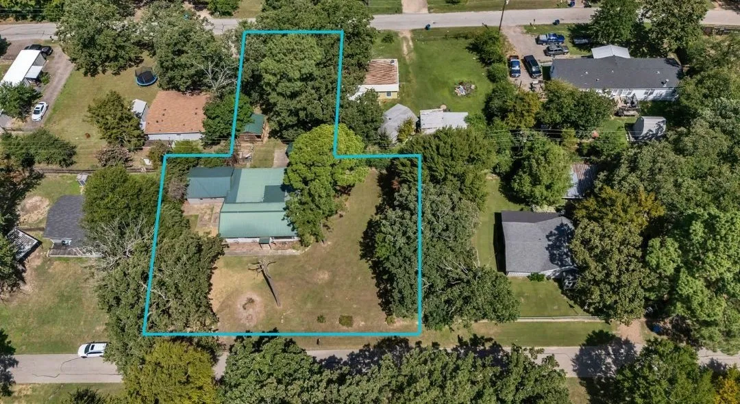 Aerial view of all 4 lots and surrounding area featuring property parcel outlined