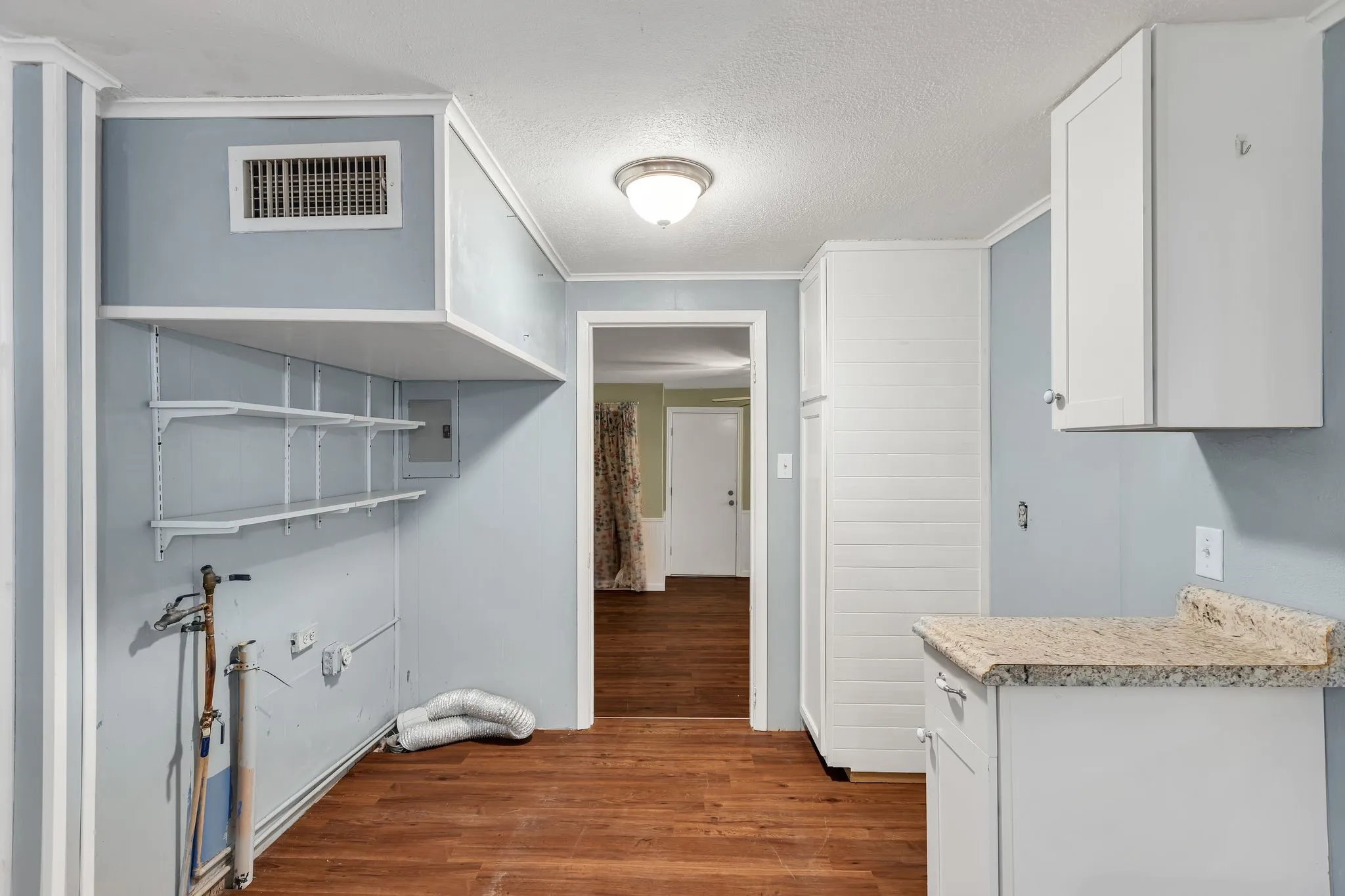 Washroom featuring dark wood finished floors