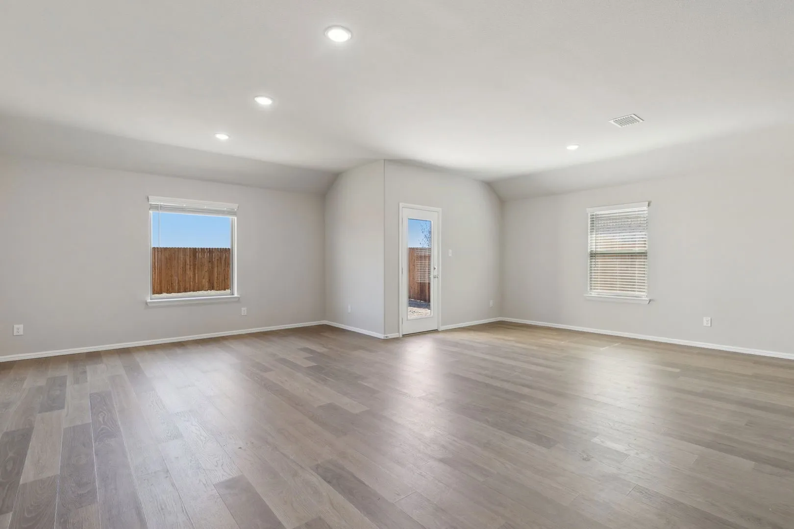 Dining and Living Room in the Harrison home plan by Trophy Signature Homes – REPRESENTATIVE PHOTO