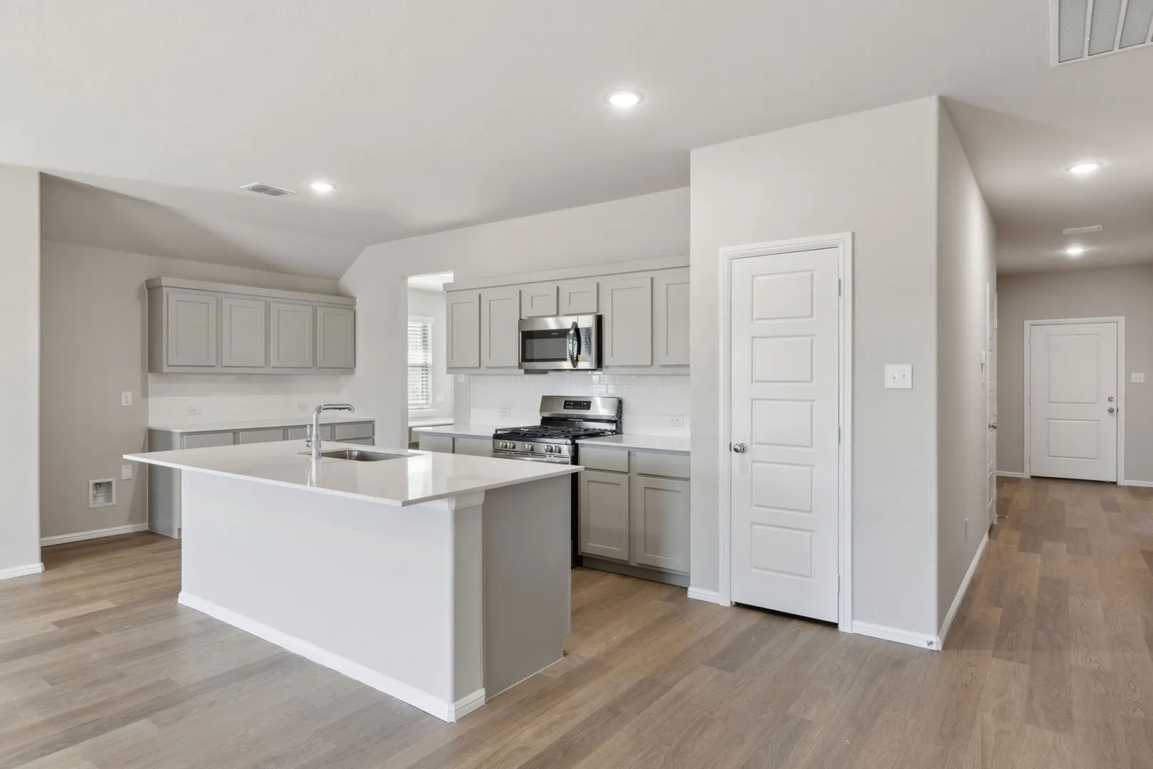 Kitchen in the Harrison home plan by Trophy Signature Homes – REPRESENTATIVE PHOTO