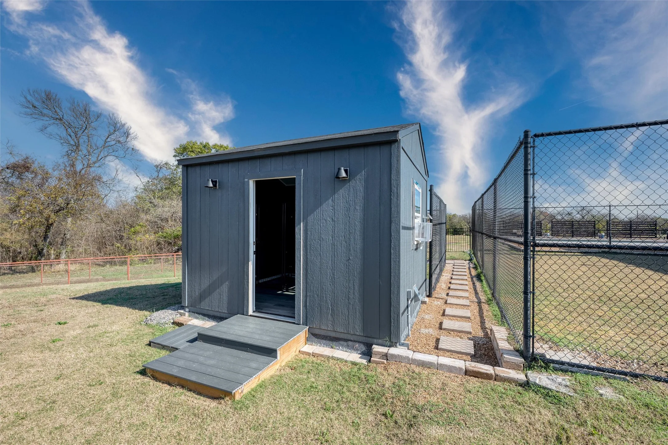 View of shed featuring a fenced backyard