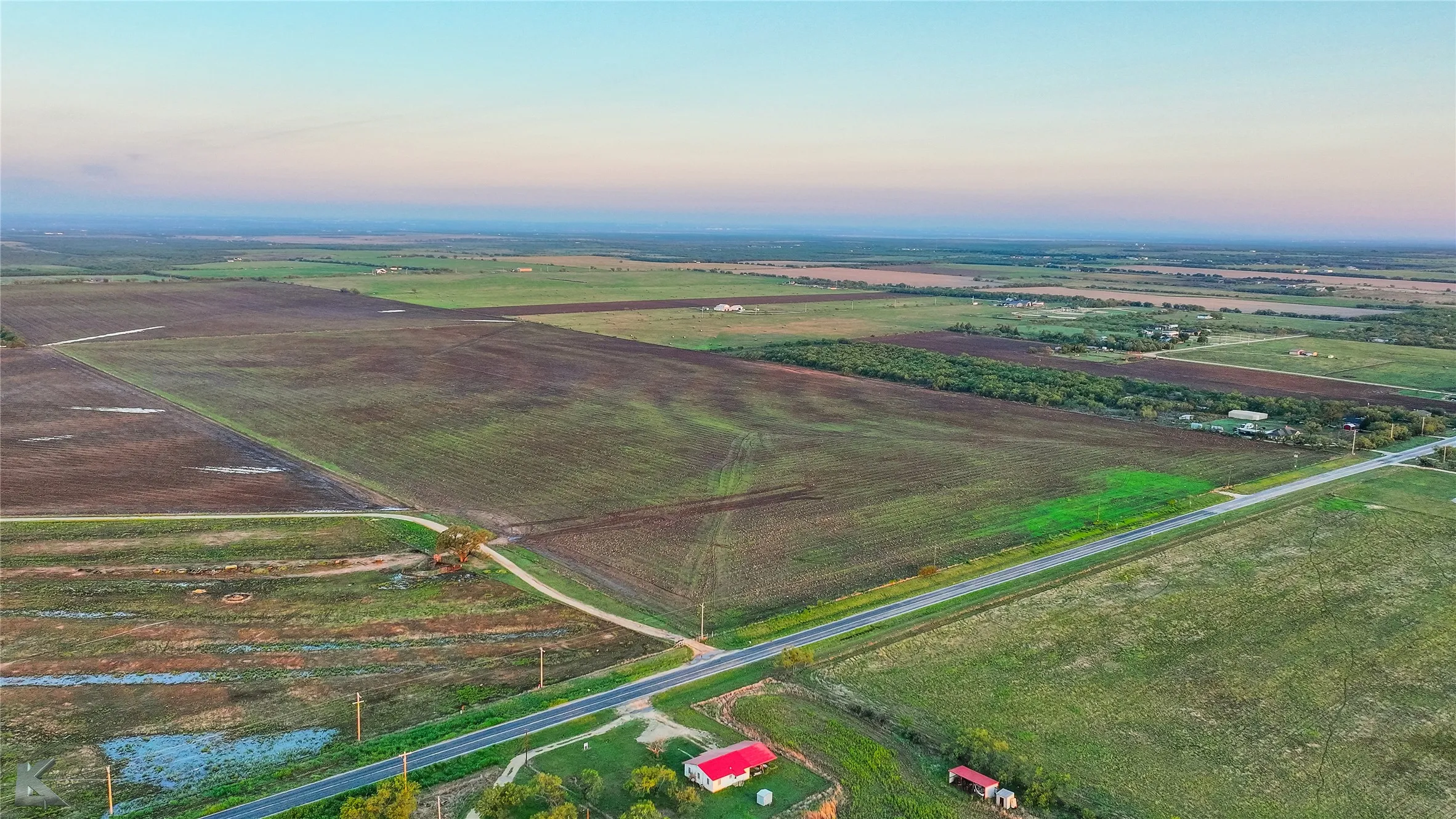 Aerial view of sparsely populated area with abundant farmland