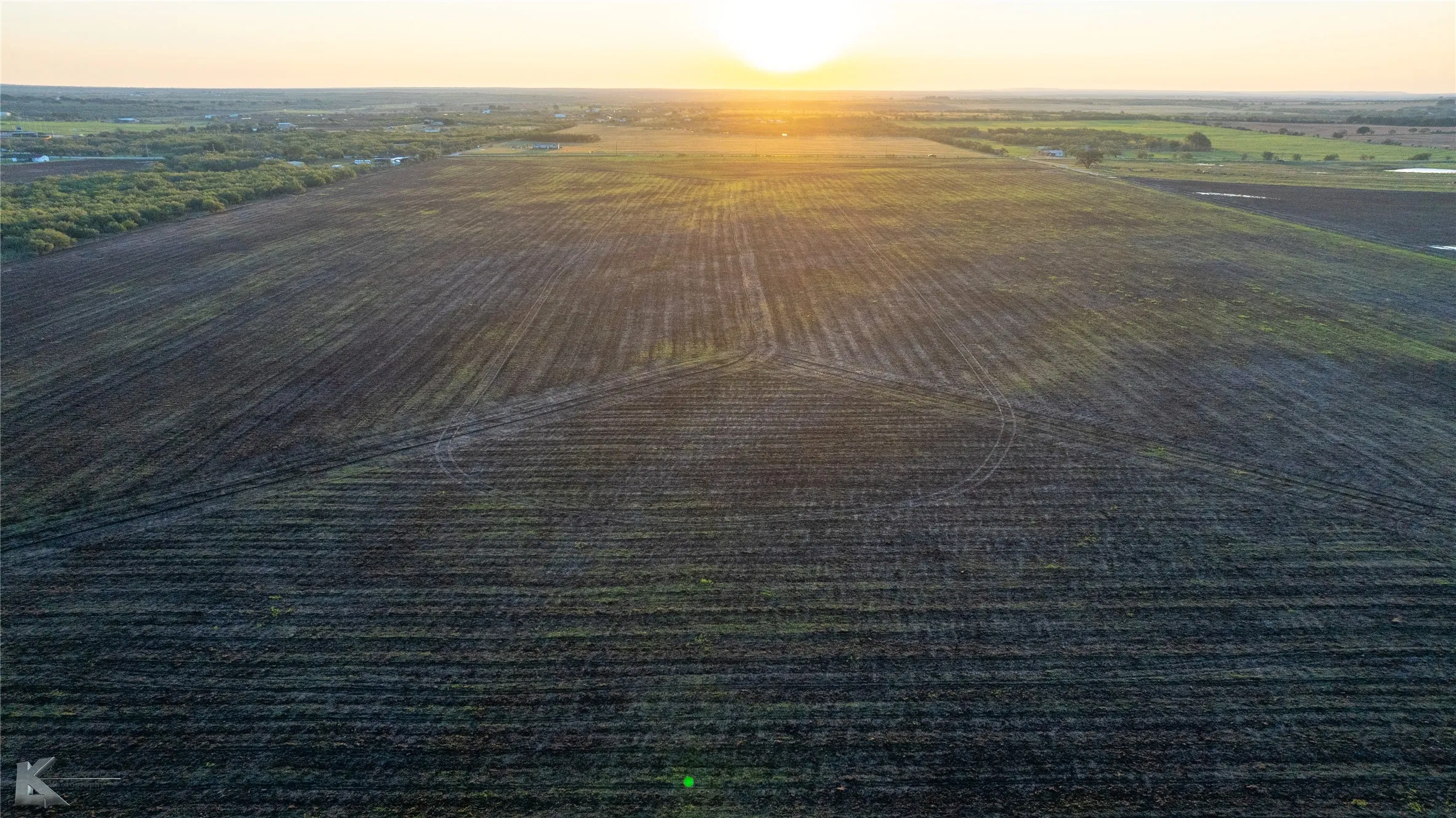 Aerial view at dusk of a view of rural / pastoral area and agricultural area