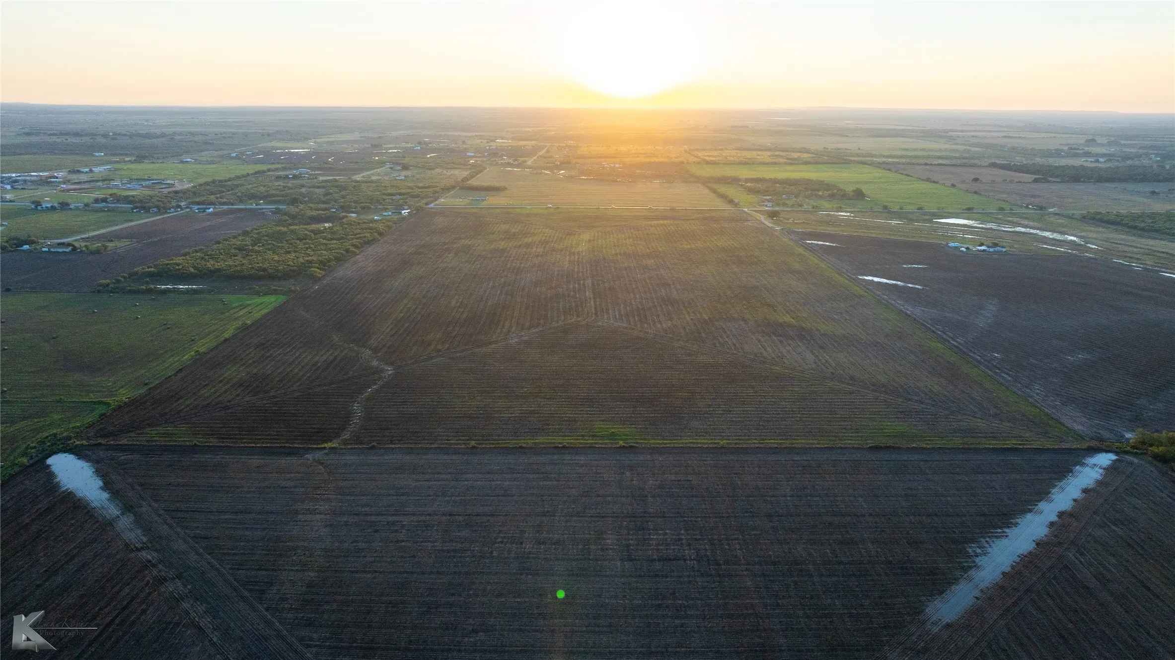 Overview of rural landscape featuring extensive farmland