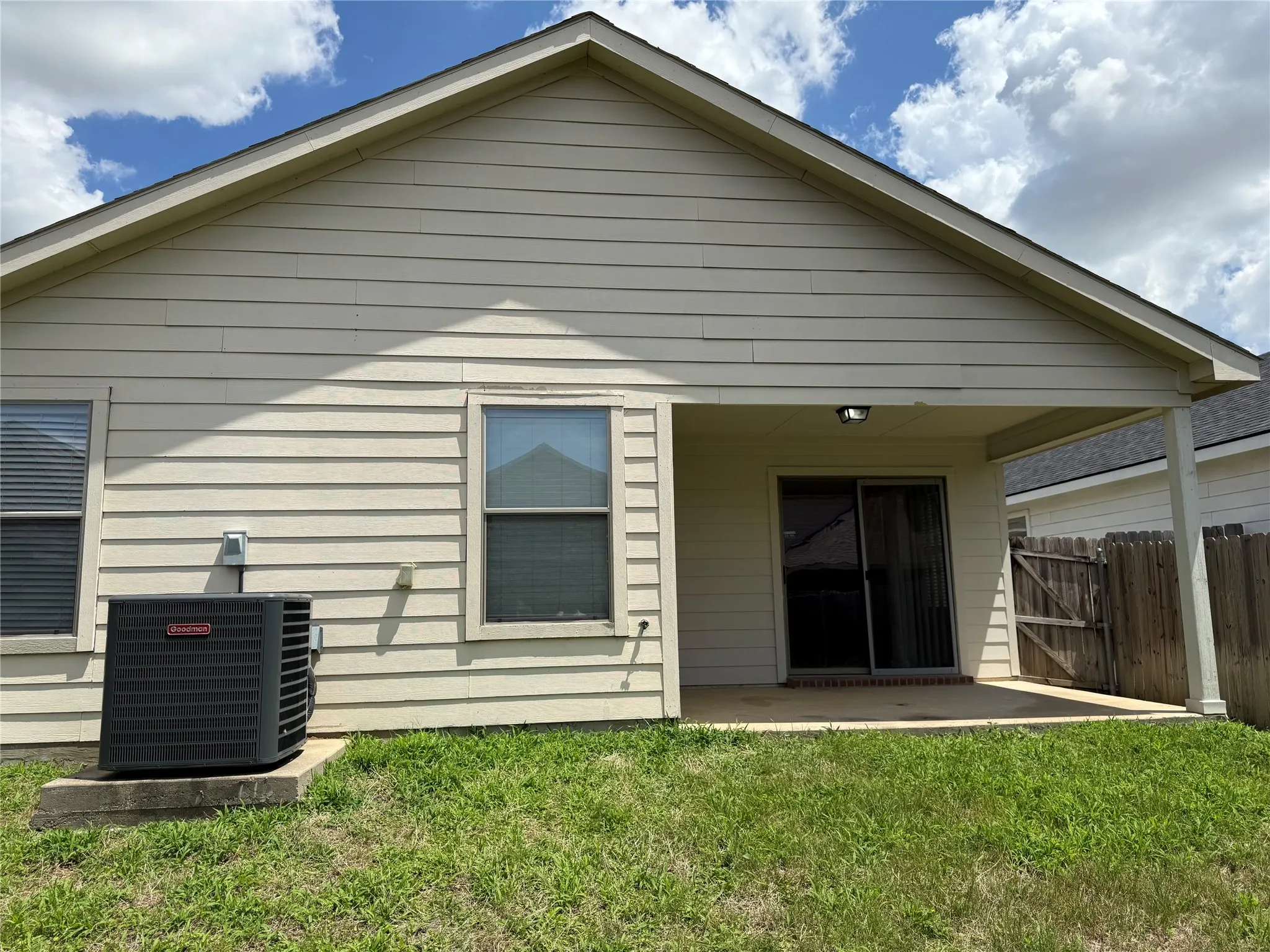 Rear view of property with a patio area