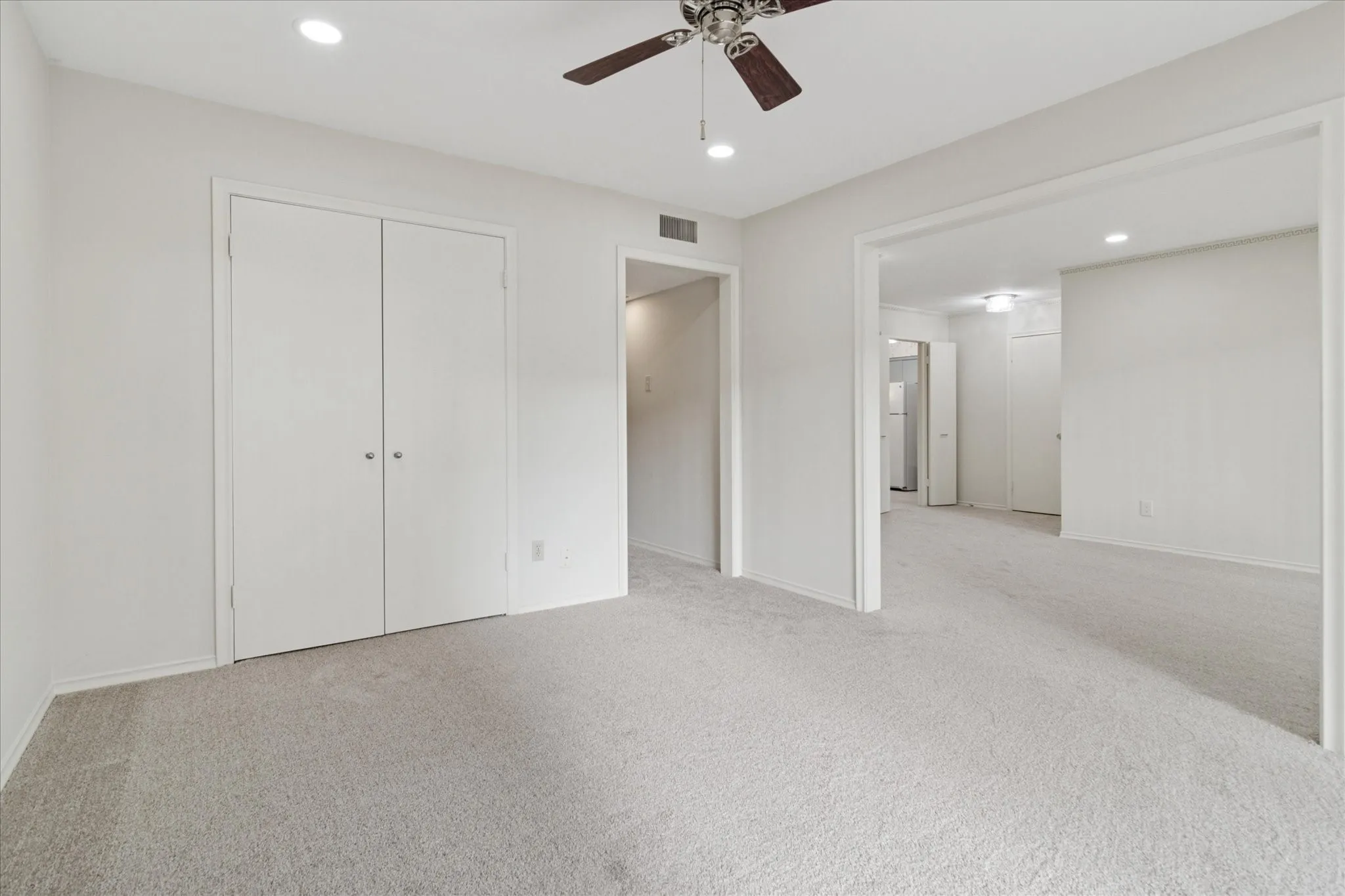 Bedroom with walk in closet and ensuite bath