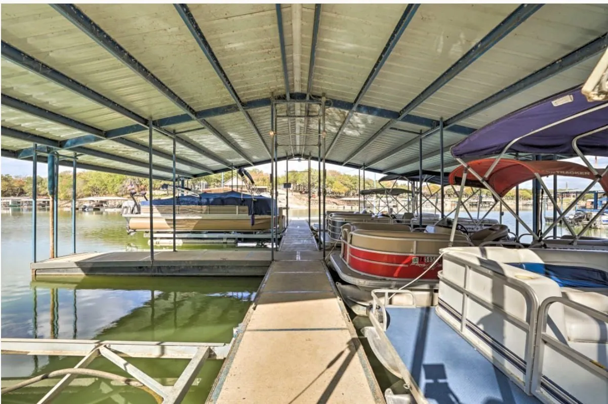 Dock featuring a water view and boat lift