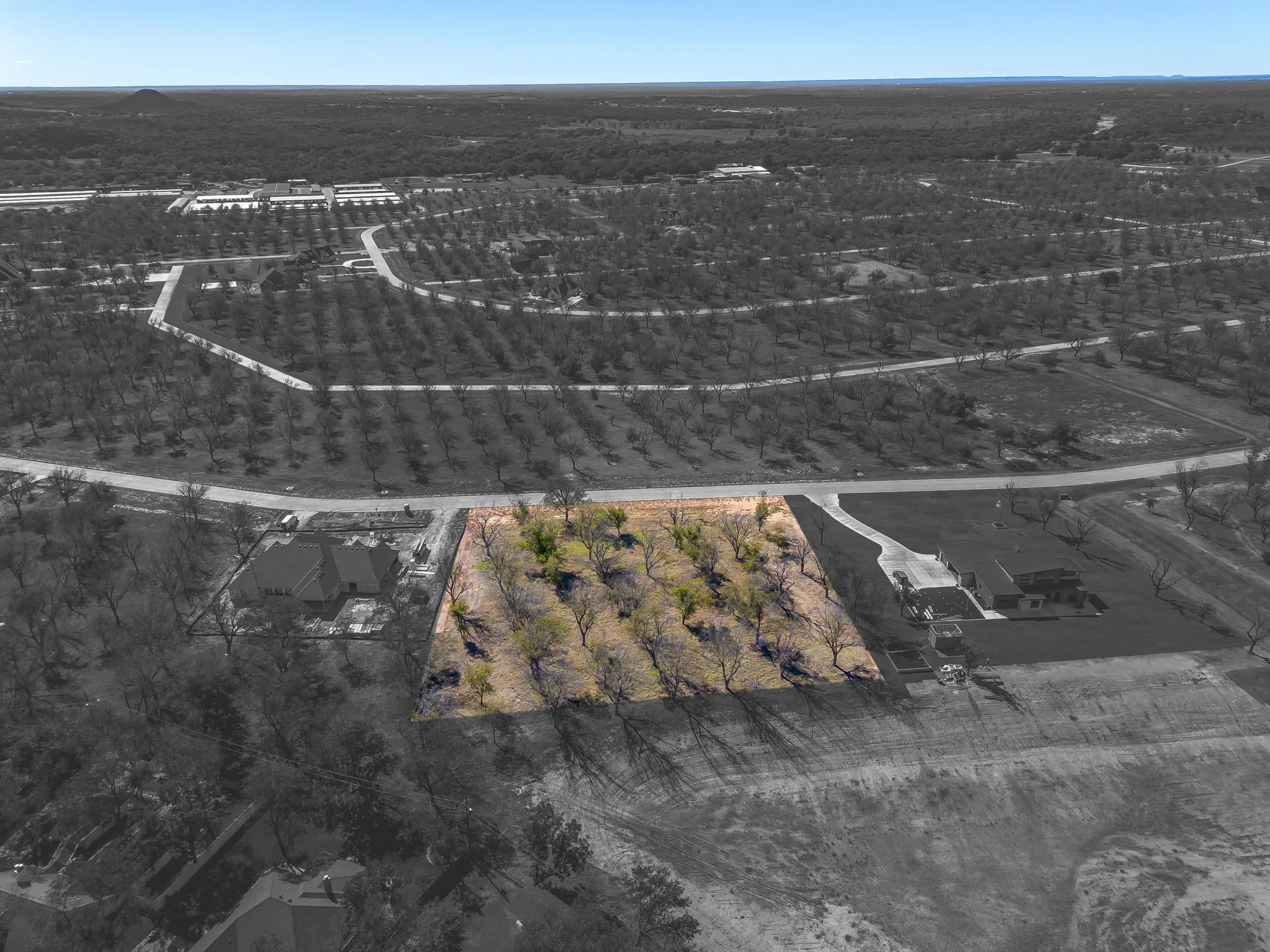 Aerial view of property and surrounding area with property parcel outlined