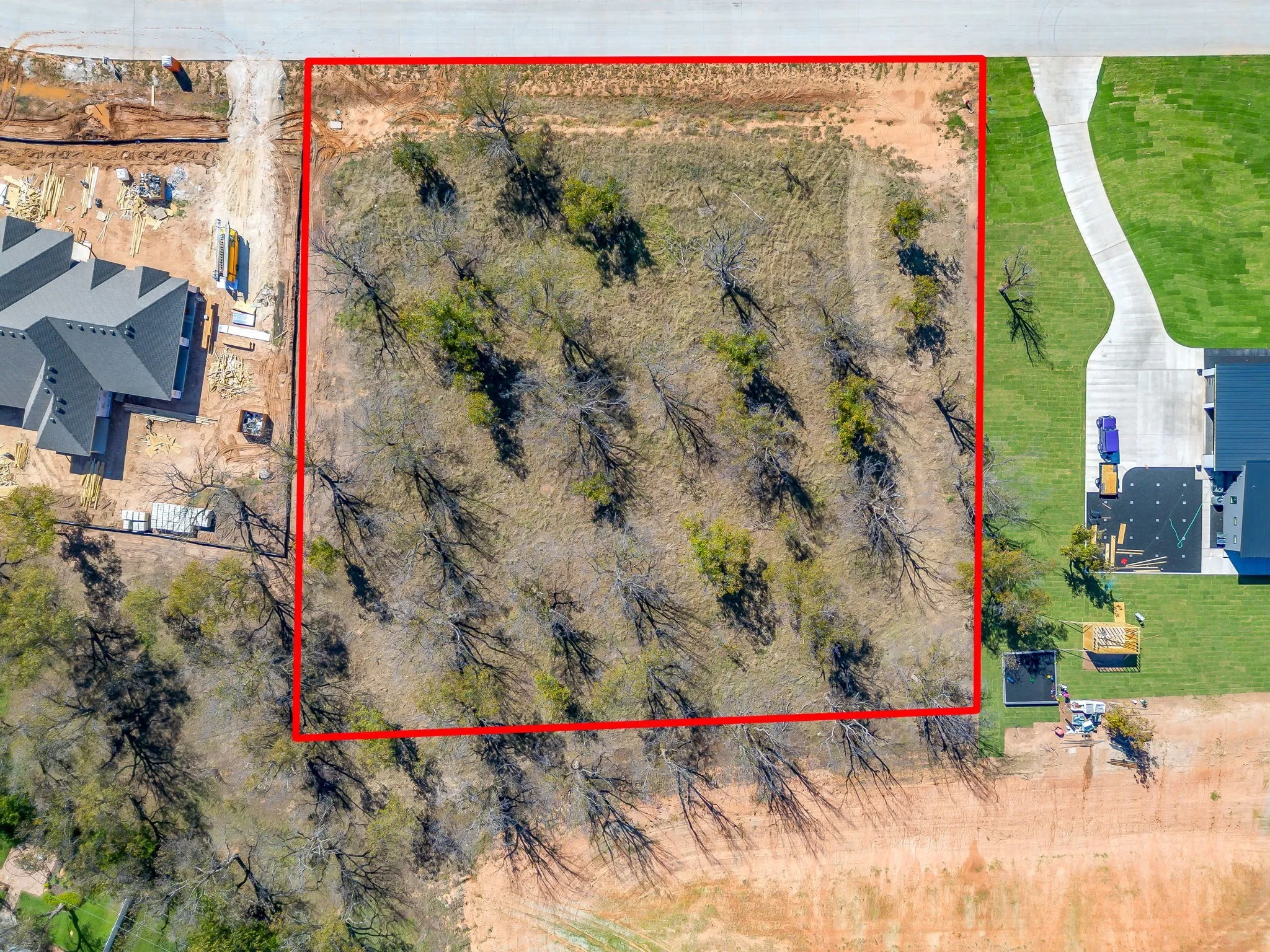 Aerial view of property and surrounding area featuring property parcel outlined