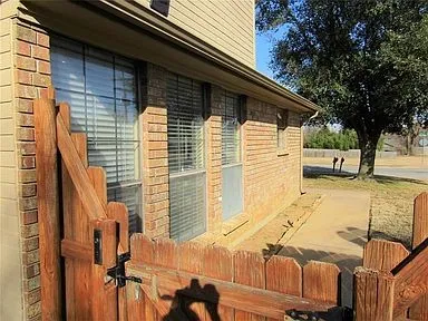 View of property exterior featuring brick siding