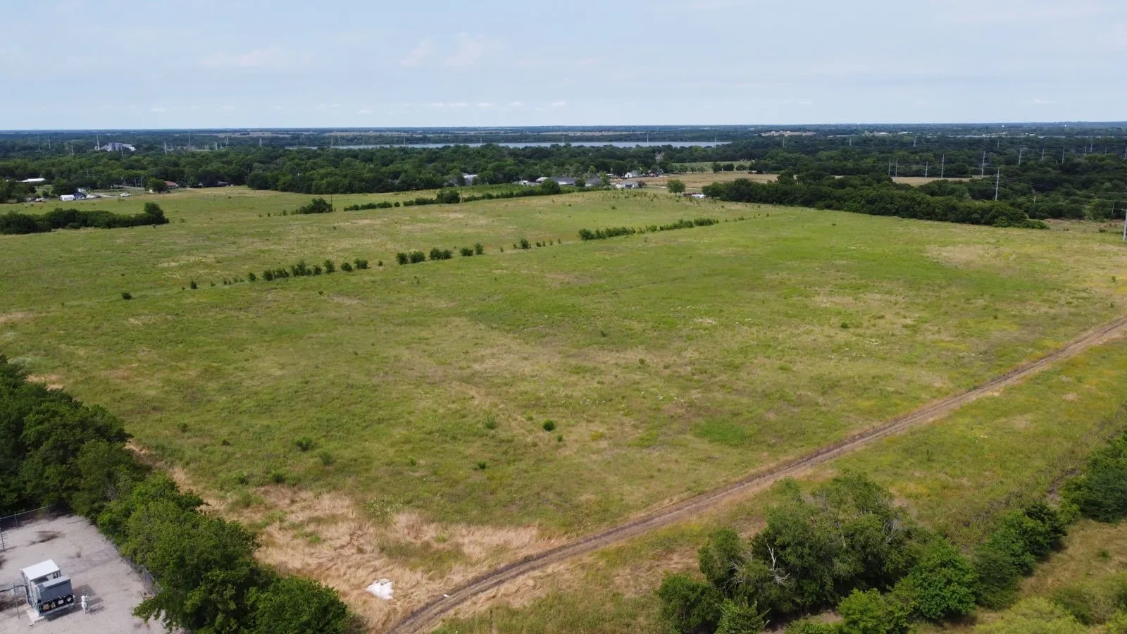 Overview of rural landscape featuring a tree filled landscape