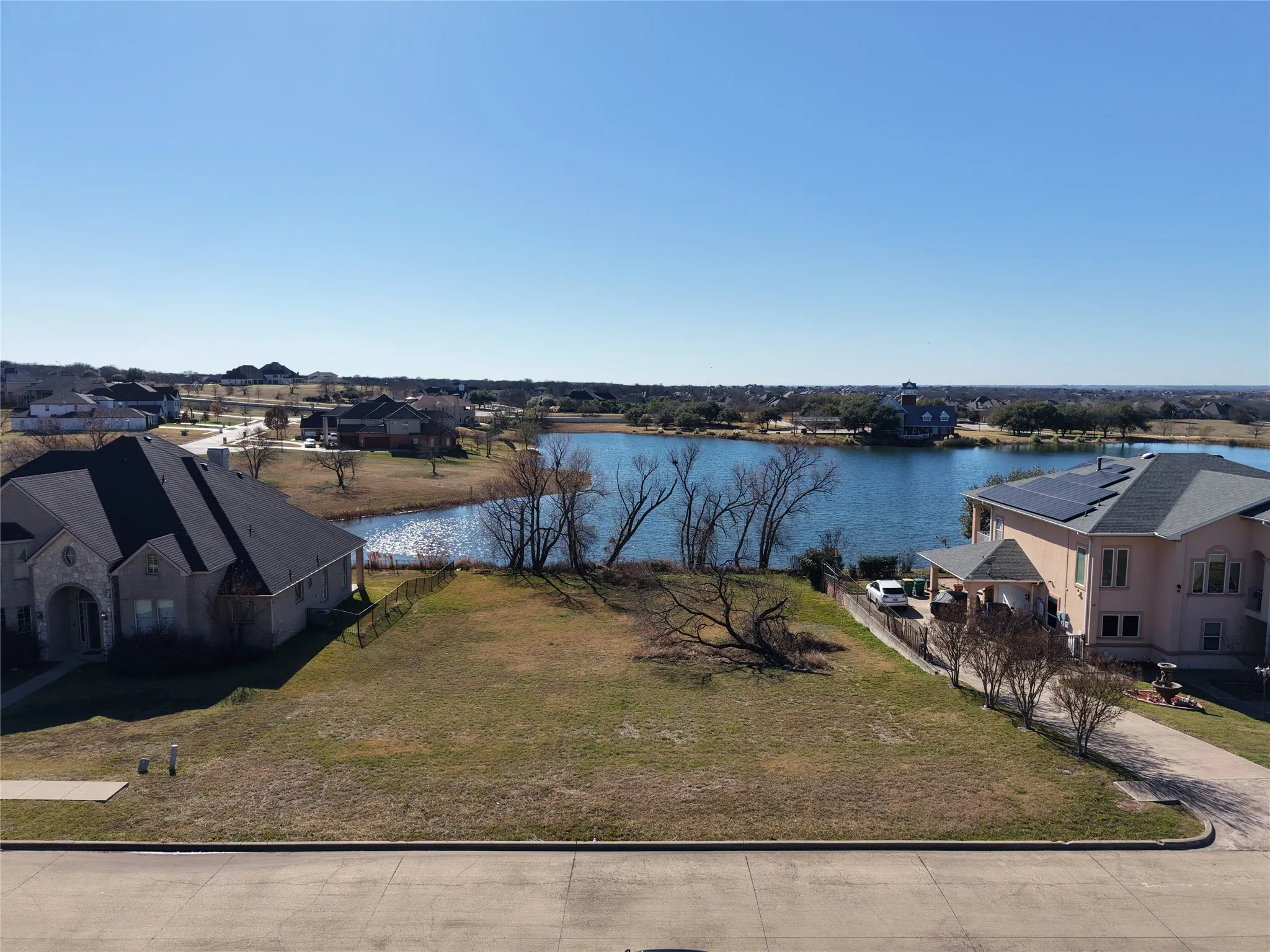 Aerial view of residential area with a large body of water