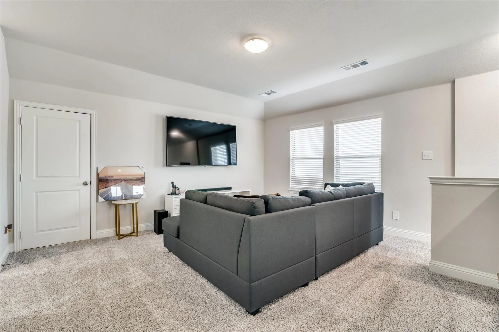 Living room featuring light carpet and baseboards
