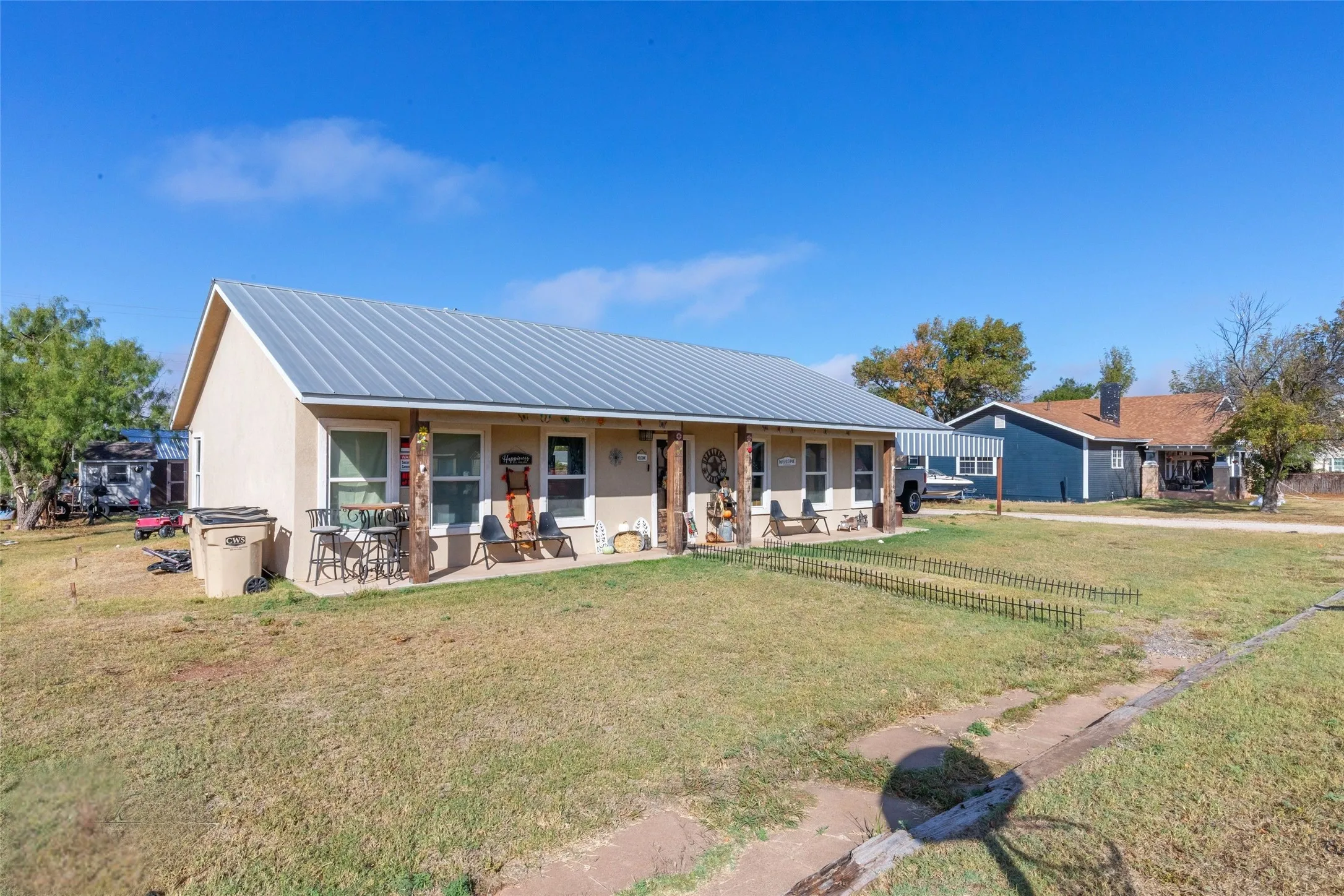 Welcome Home! Located on a large corner lot with a detached carport