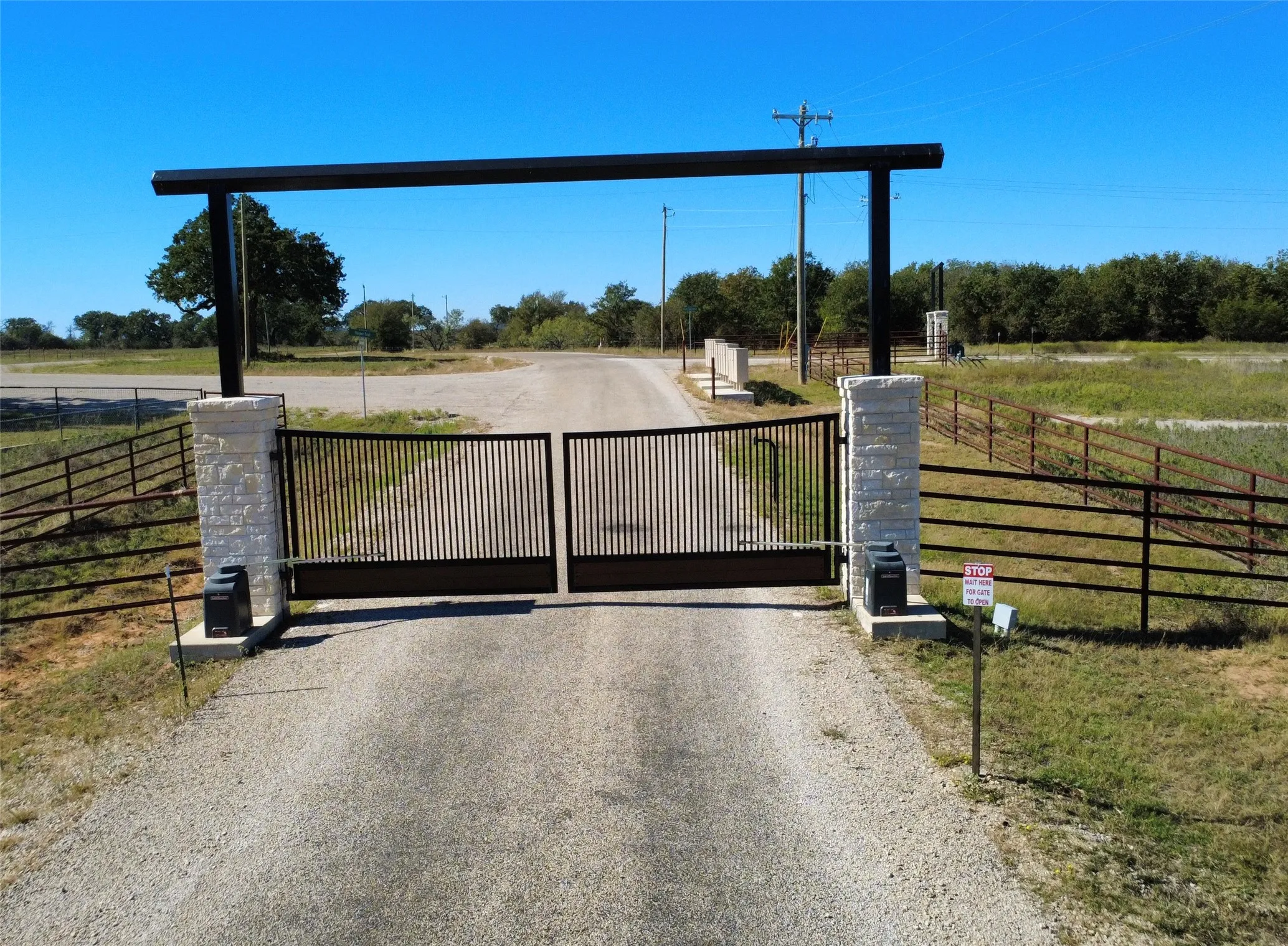 View of road with a gate and a view of countryside