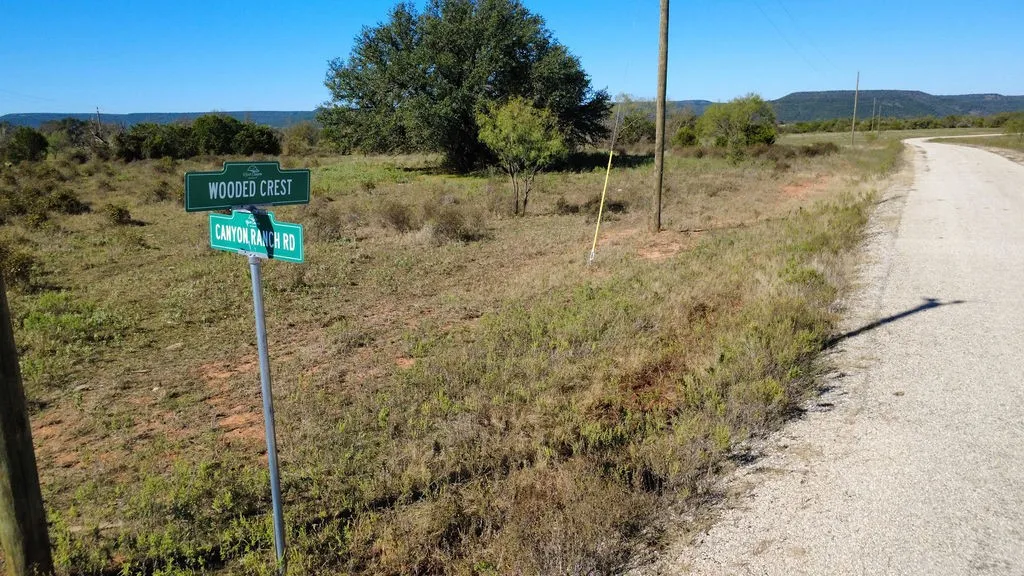 View of dirt / gravel road with a rural view