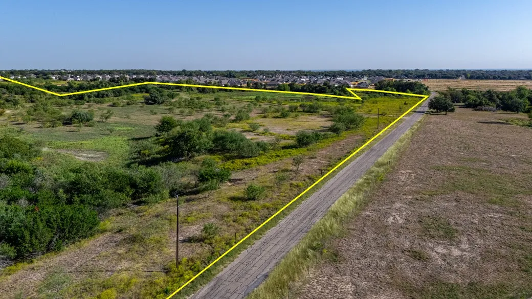 View of rural area with rows of crops and property parcel outlined