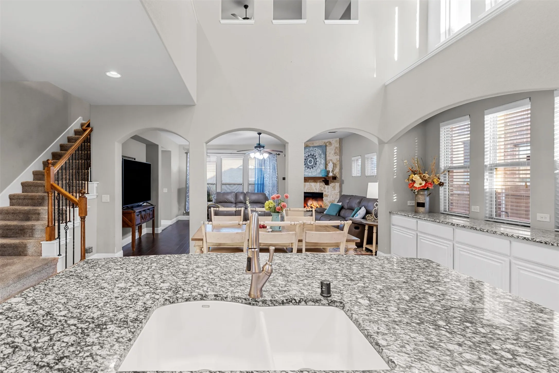 Kitchen looks out to the main living and additional storage in the dining space