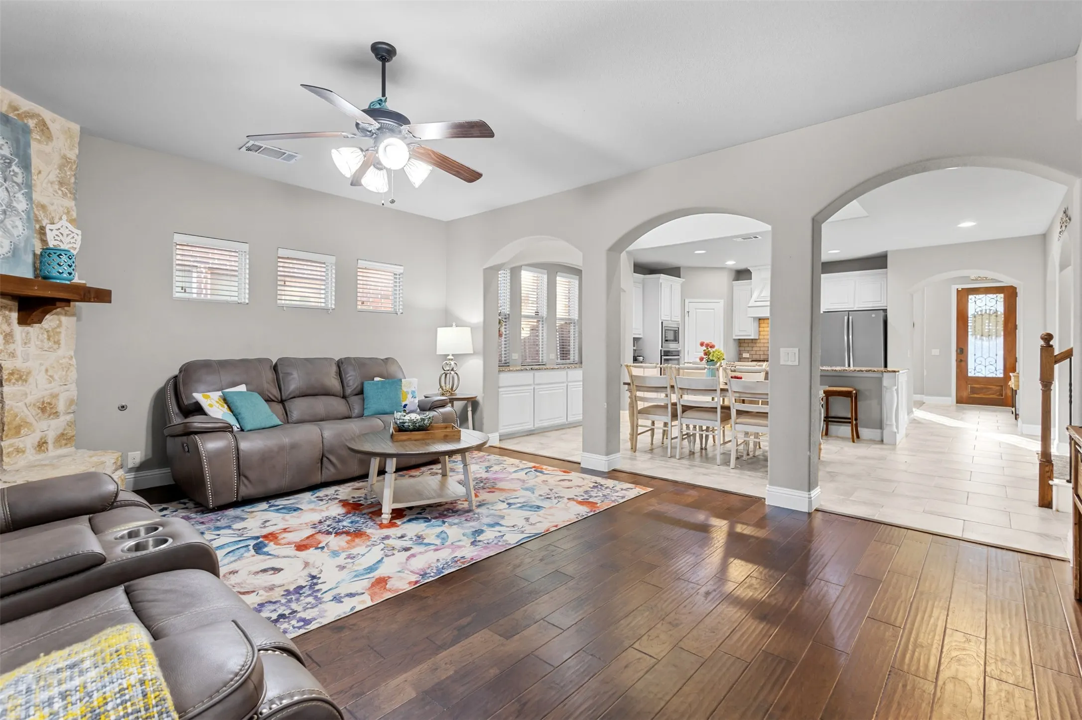 Living room is open to kitchen and dining with beautiful arch details