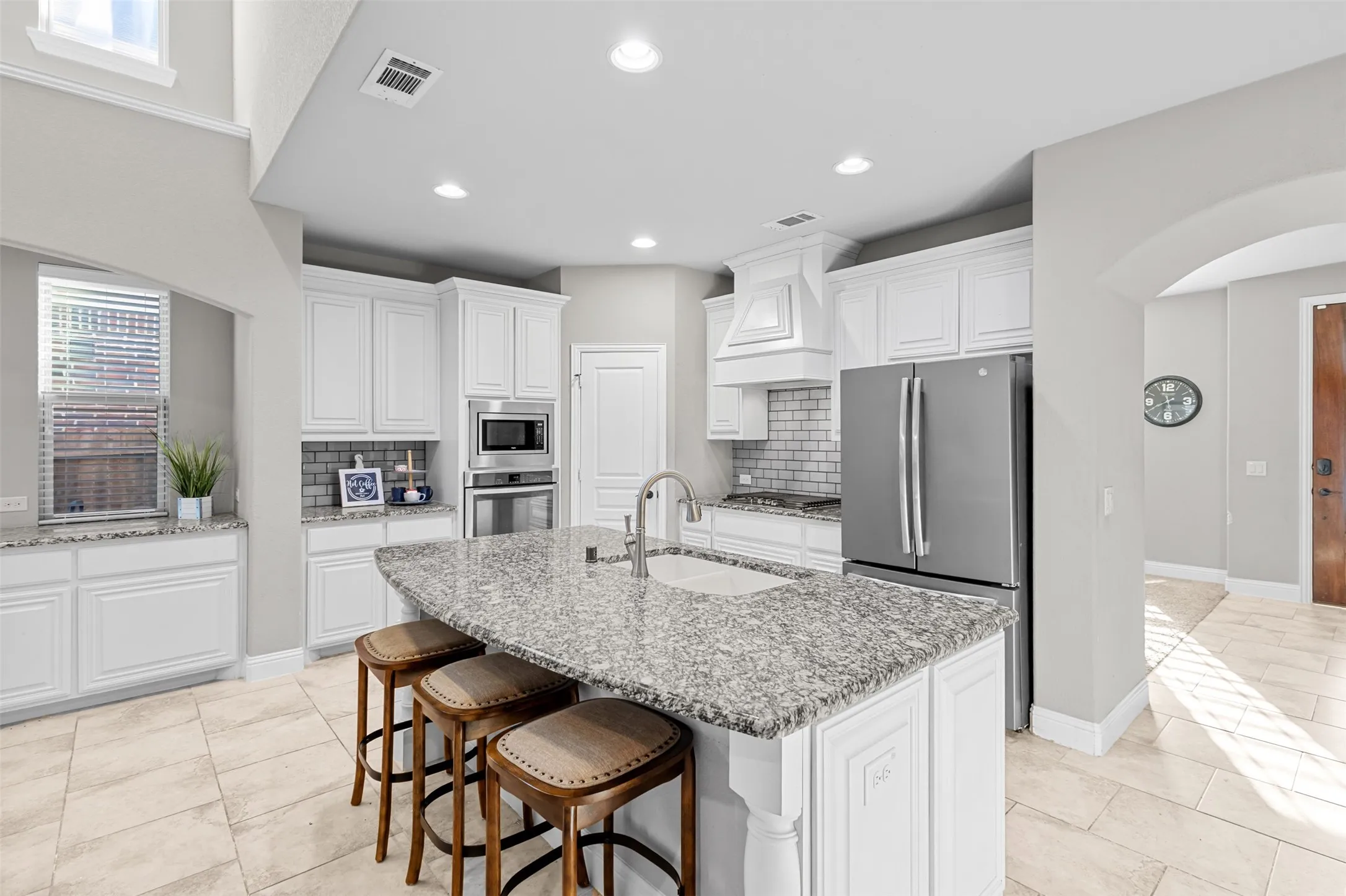 Huge kitchen island provides the opportunity for additional seating