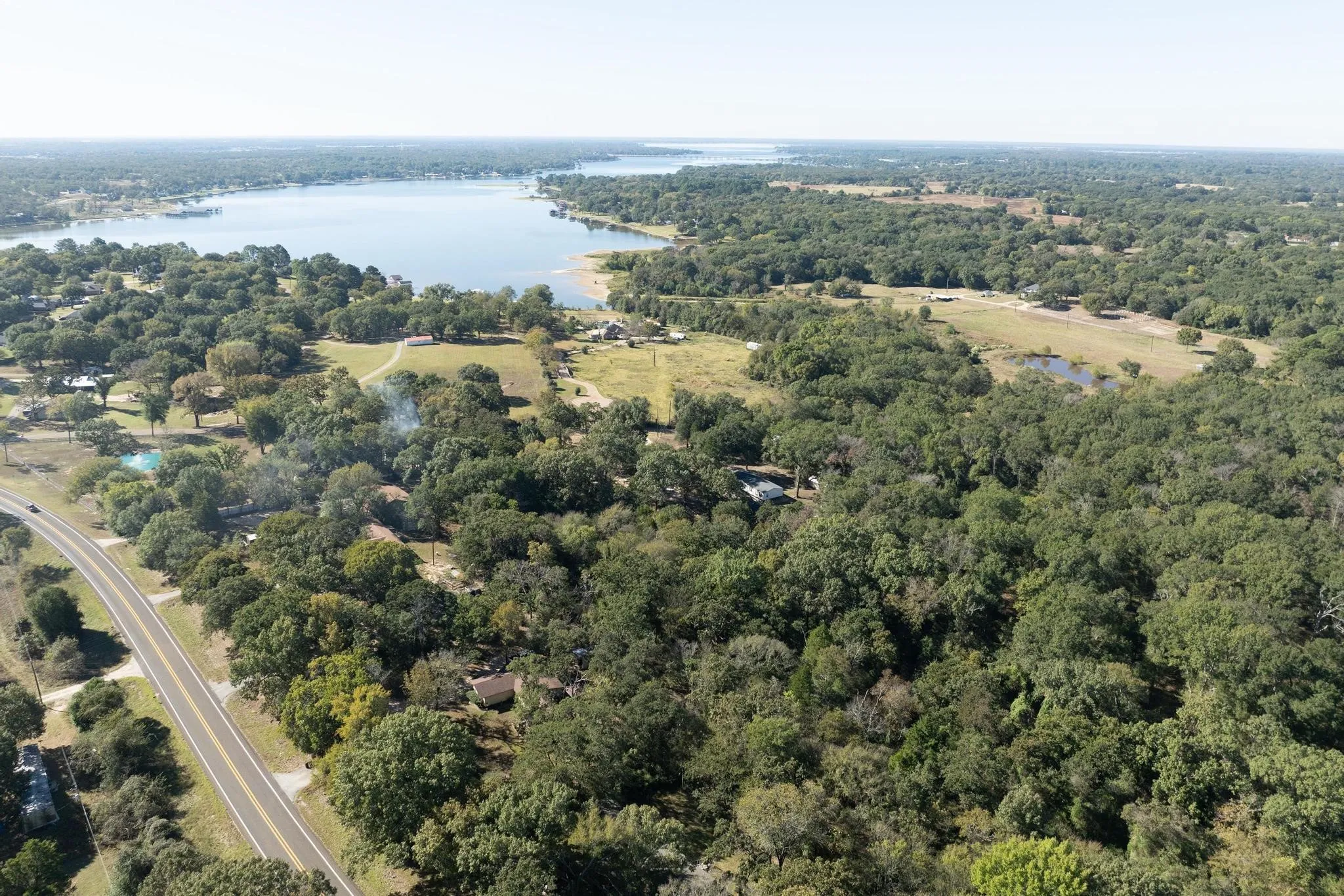 Aerial view of a large body of water and a forest