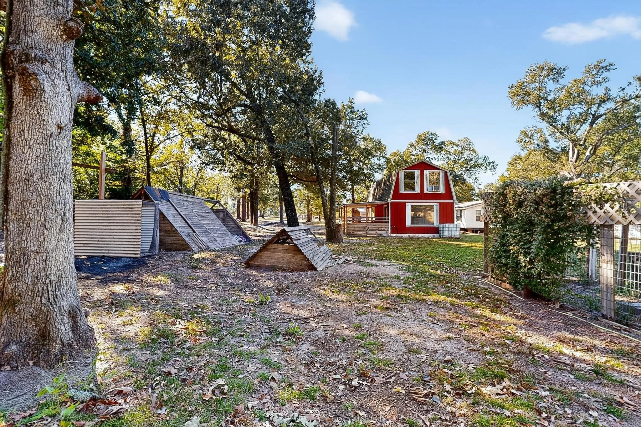 View of yard with a wooden deck and an outbuilding