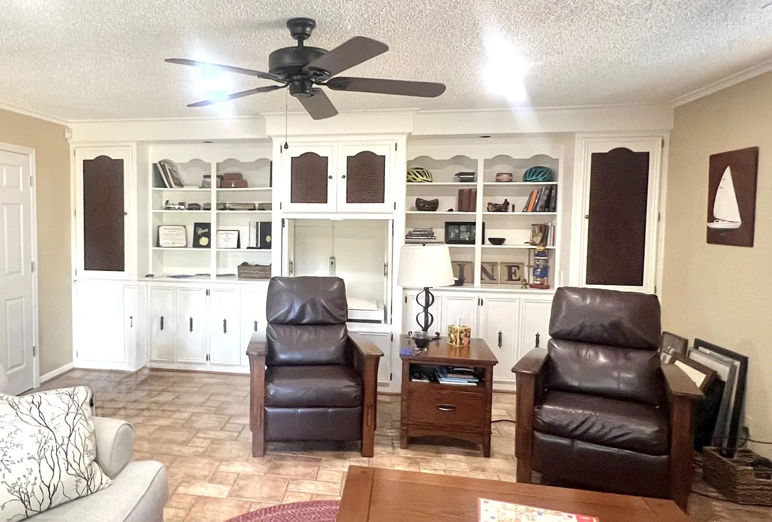 Game room is spacious and features built in cabinets and space fror any design.
