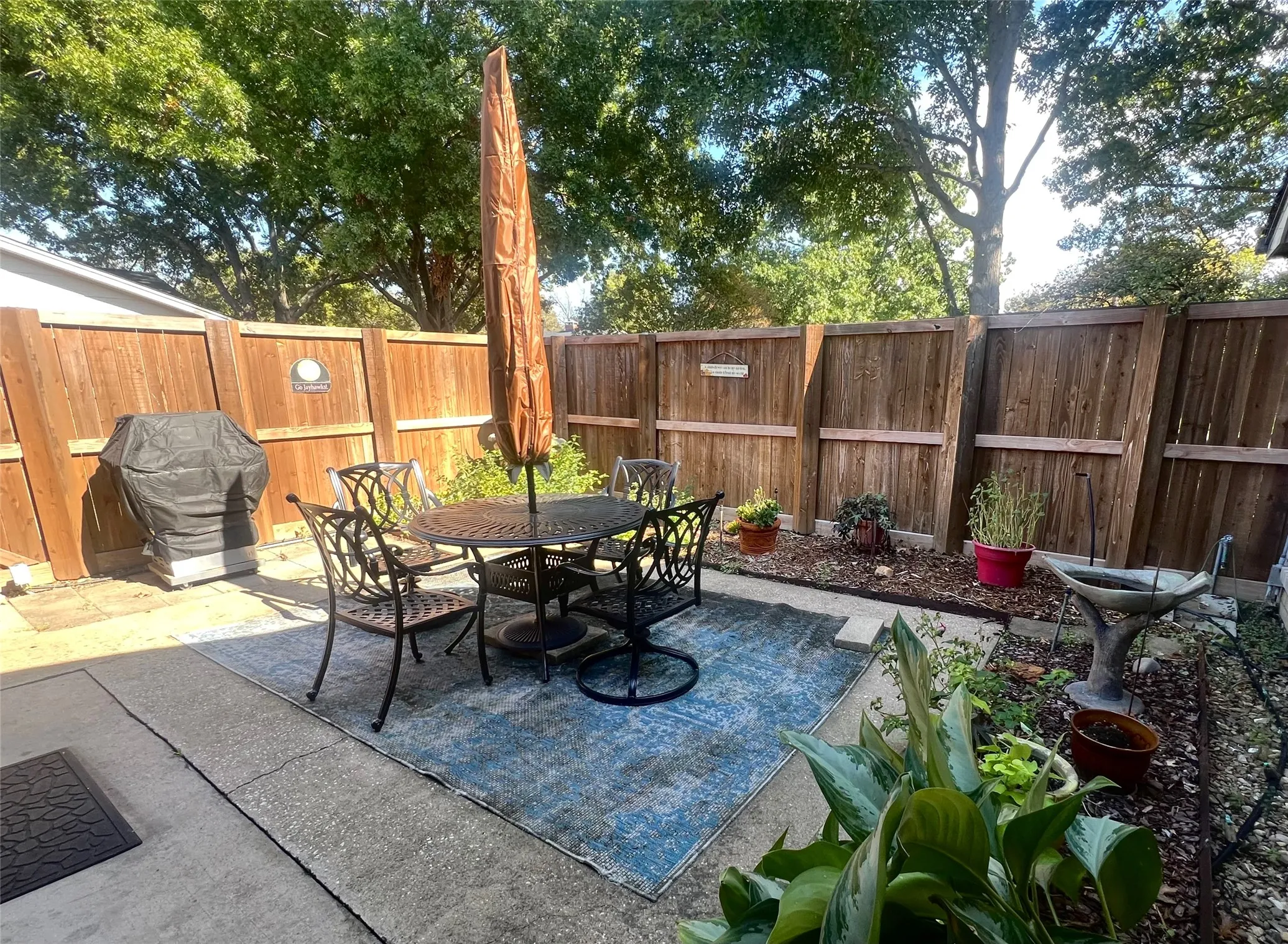 Front Courtyard, room for dining, a grill, lots of flowers.