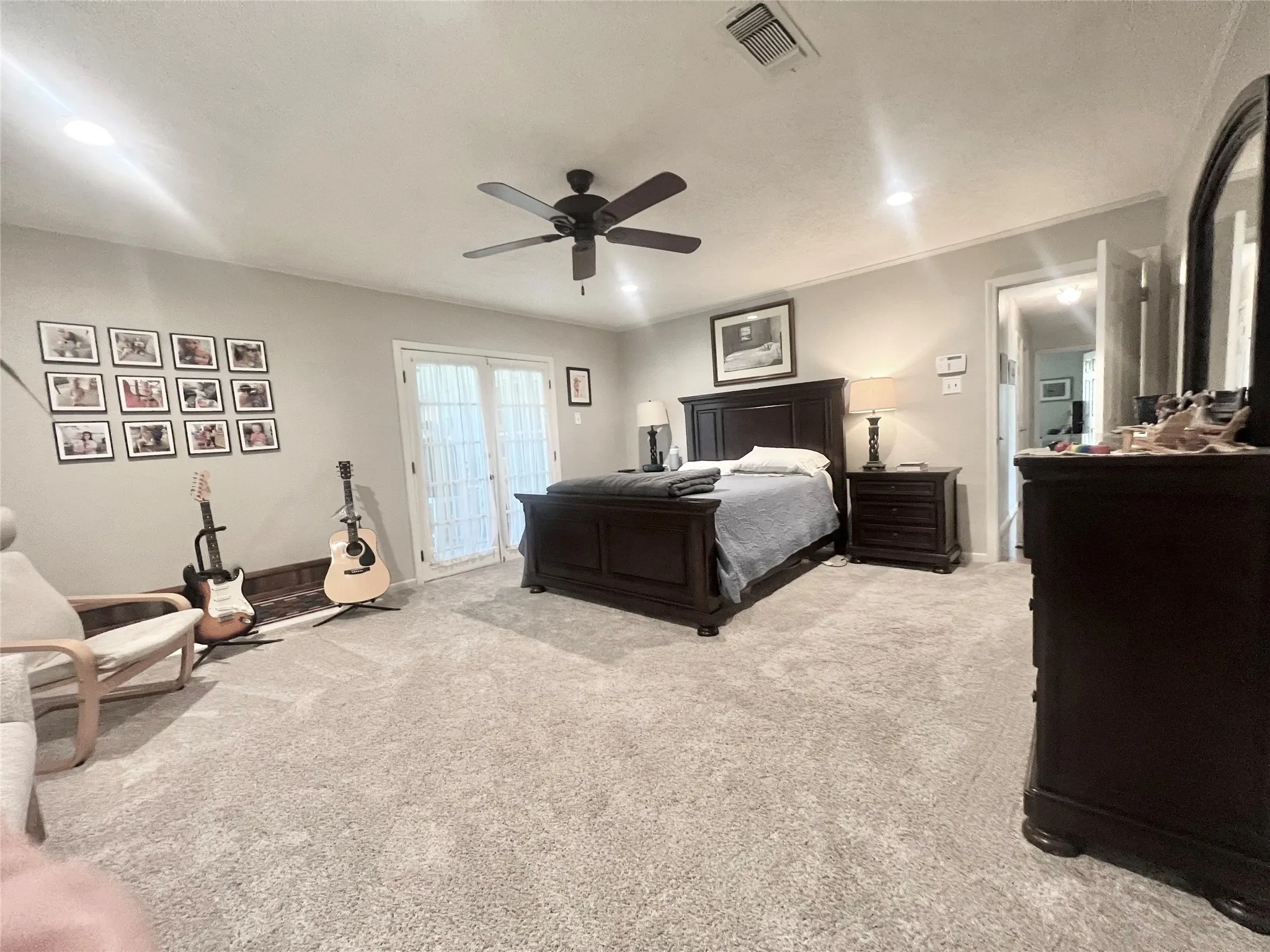 Bedroom with light colored carpet, access to outside, a ceiling fan, and recessed lighting