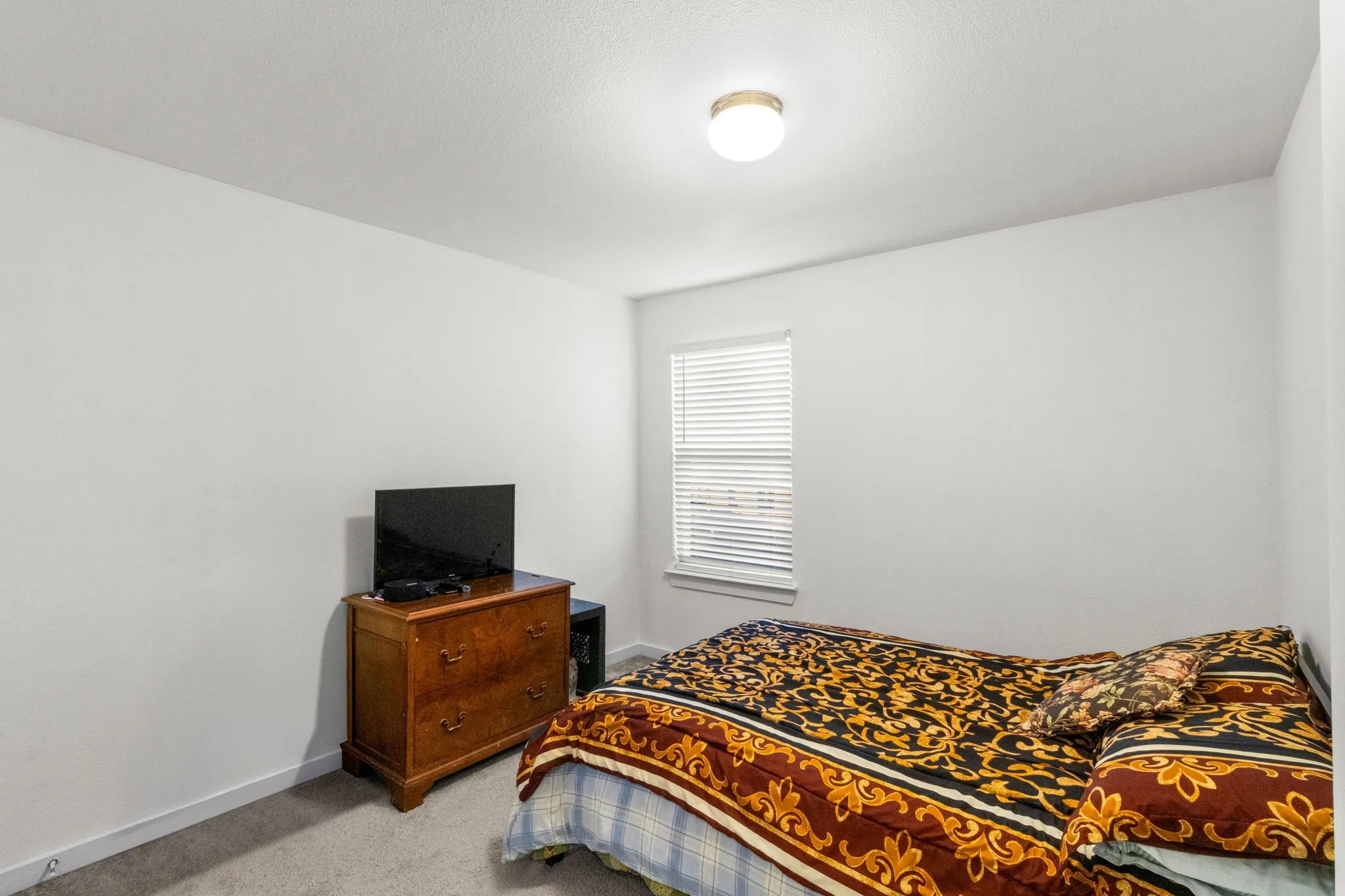Bedroom with carpet and baseboards