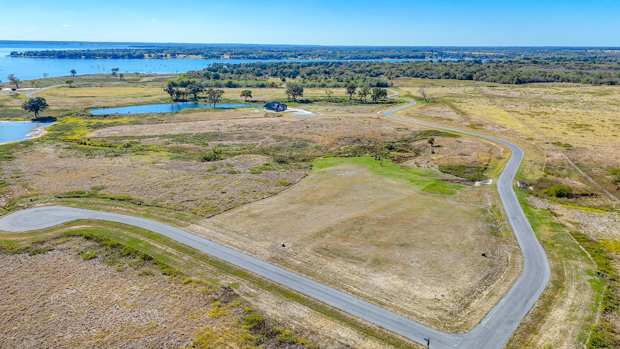 Aerial view of sparsely populated area with a nearby body of water