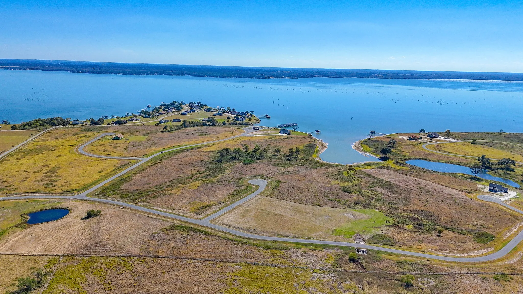 Aerial overview of property's location featuring a large body of water