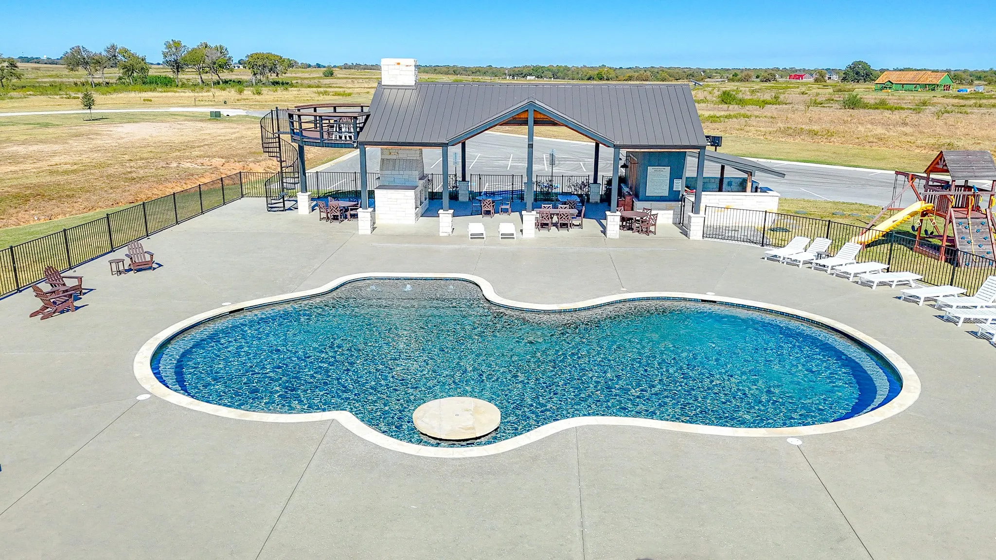 Community pool featuring a patio area